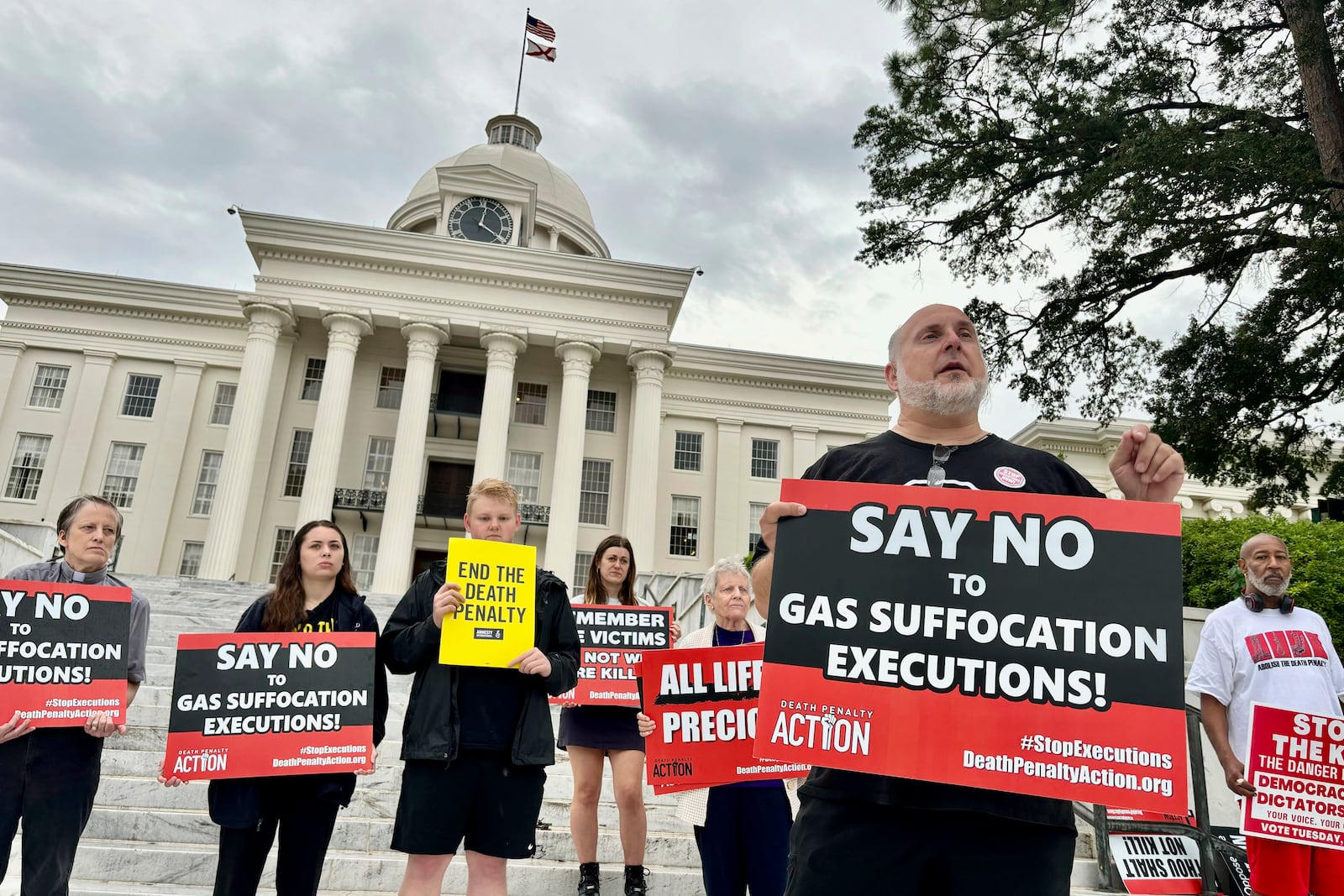 FILE - Abraham Bonowitz, front, executive director of Death Penalty Action, and other death penalty opponents hold a demonstration outside the Alabama Capitol in Montgomery, Ala., Wednesday, Sept. 25, 2024. (AP Photo/Kim Chandler, File)