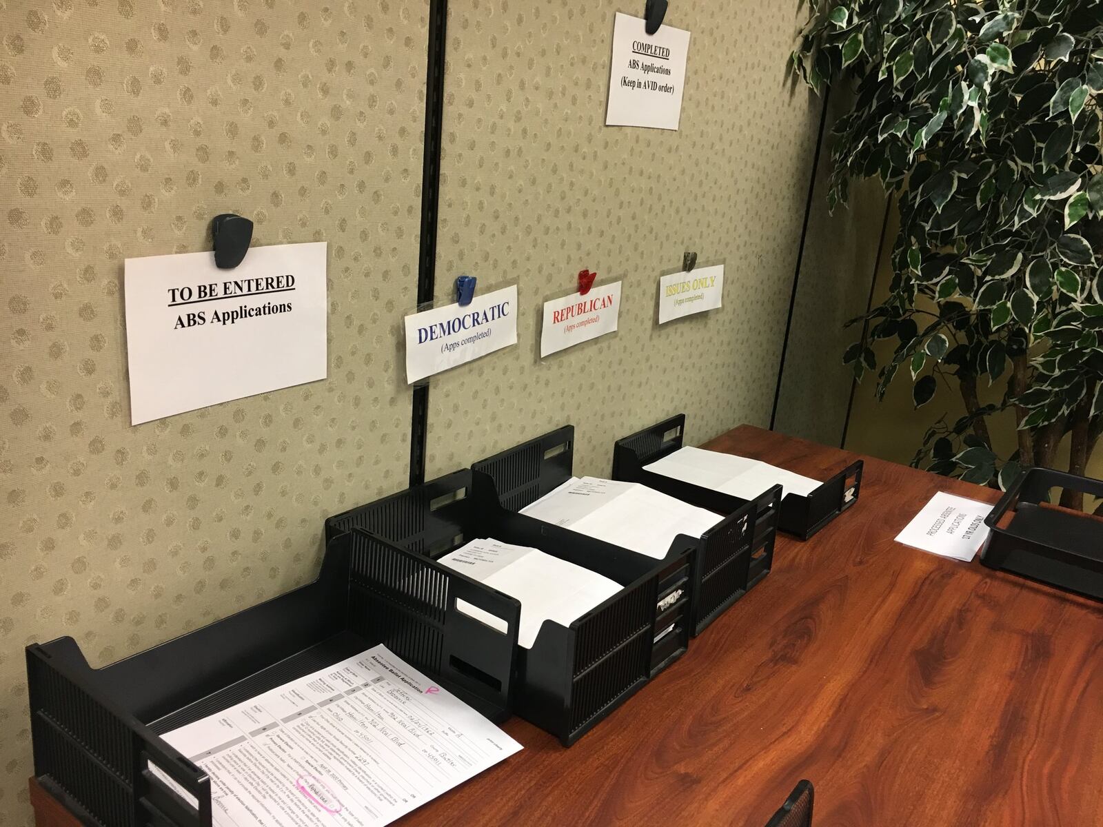 The Butler County Board of Elections is handling absentee ballot requests for the 2020 primary election. Pictured on Tuesday, March 31, 2020, are some of the several hundred of absentee ballot request forms the Butler County Board of Elections received this week. MICHAEL D. PITMAN/STAFF