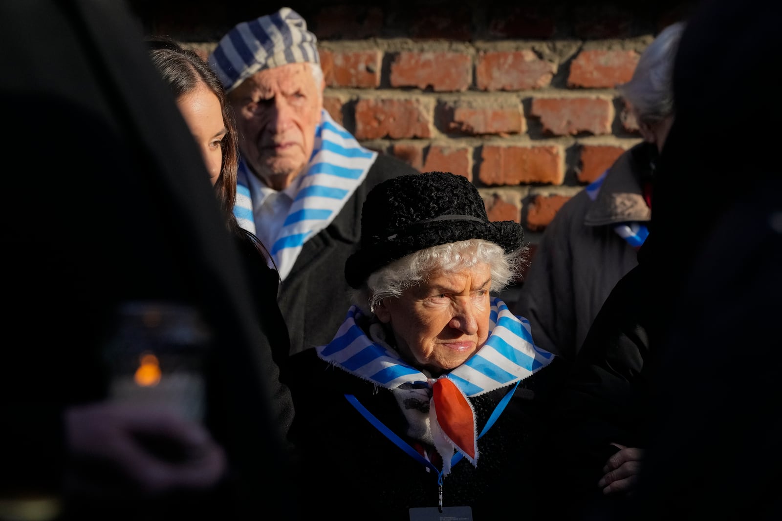 Survivors and relatives attend a ceremony at the Auschwitz-Birkenau former Nazi German concentration and extermination camp, in Oswiecim, Poland, Monday, Jan. 27. 2025. (AP Photo/Czarek Sokolowski)