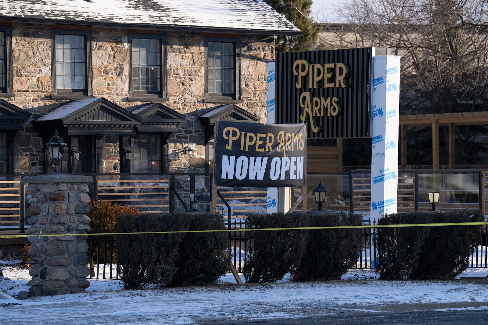 Police tape marks the scene of a shooting at a pub in Toronto, Canada, Saturday, March 8, 2025. (Arlyn McAdorey/The Canadian Press via AP)