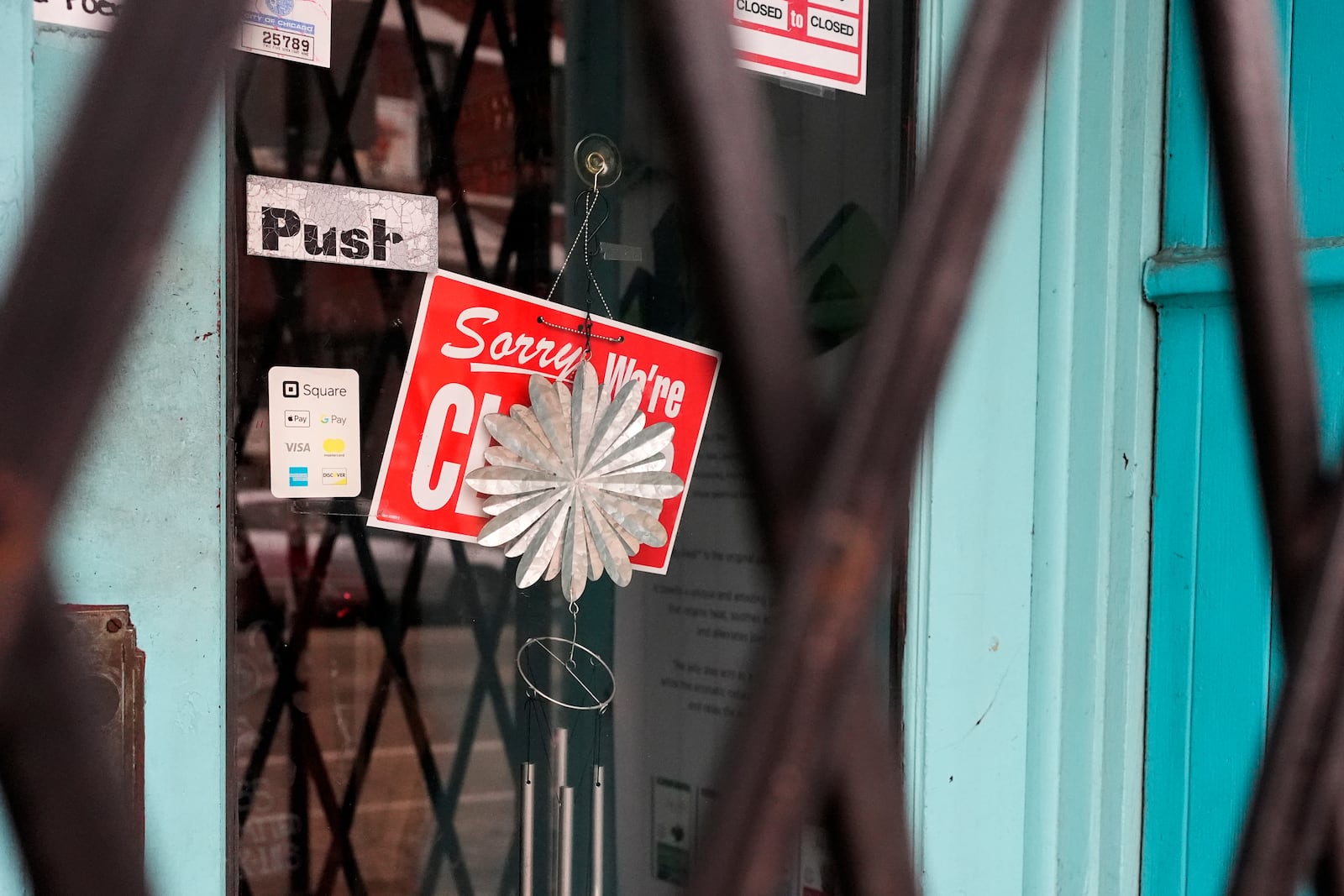 A closed sign is displayed at a local business in the Pilsen neighborhood of Chicago to stand with immigrants in Chicago, Monday, Feb. 3, 2025. (AP Photo/Nam Y. Huh)