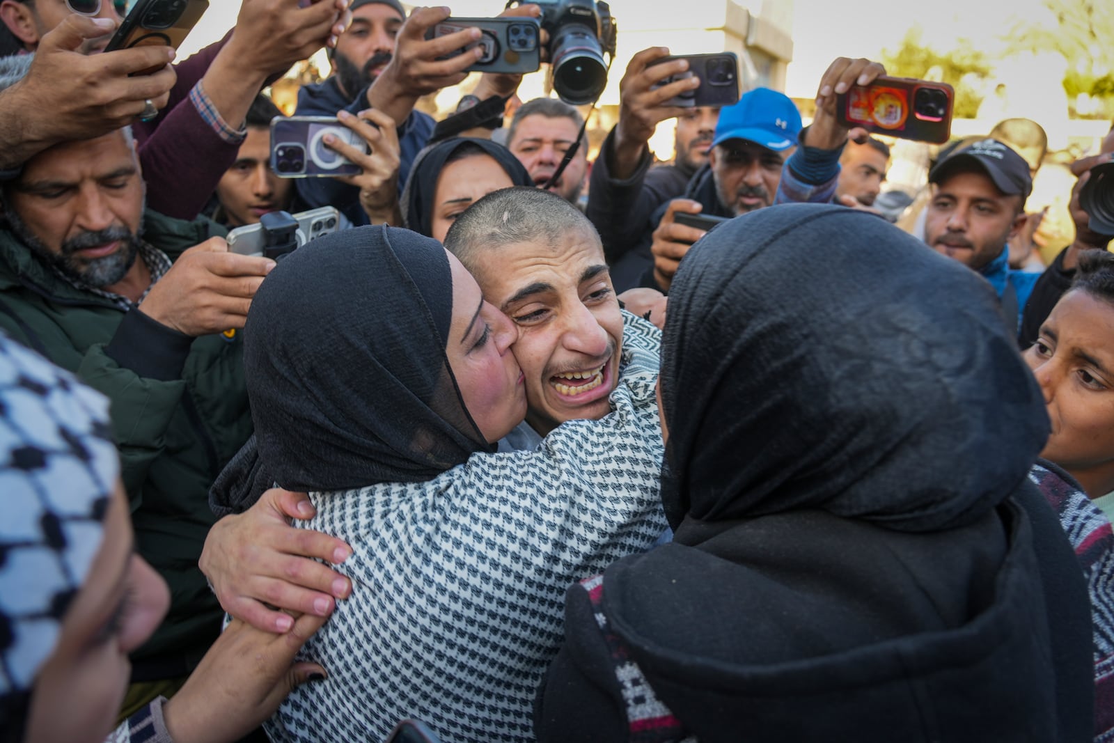 Mohammed Sahloul, 17, is greeted by his sister Nina after being released from an Israeli prison in Khan Younis, Gaza Strip, Thursday, Feb. 27, 2025. (AP Photo/Abdel Kareem Hana)