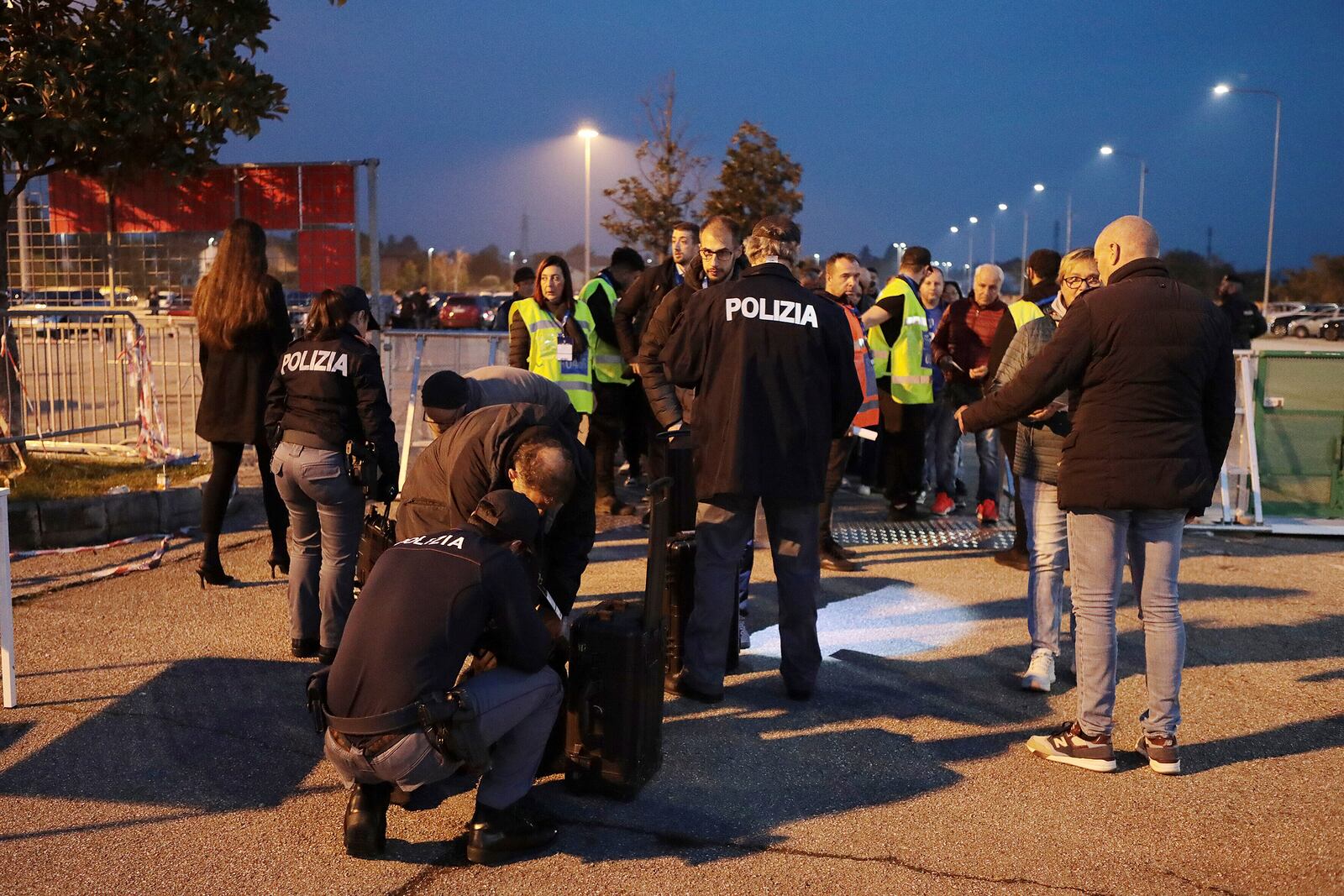 Spectators go through security checks ahead of the Nations League soccer match between Italy and Israel, at the Bluenergy stadium in Udine, Italy, Monday, Oct. 14, 2024. (Andrea Bressanutti/LaPresse via AP)