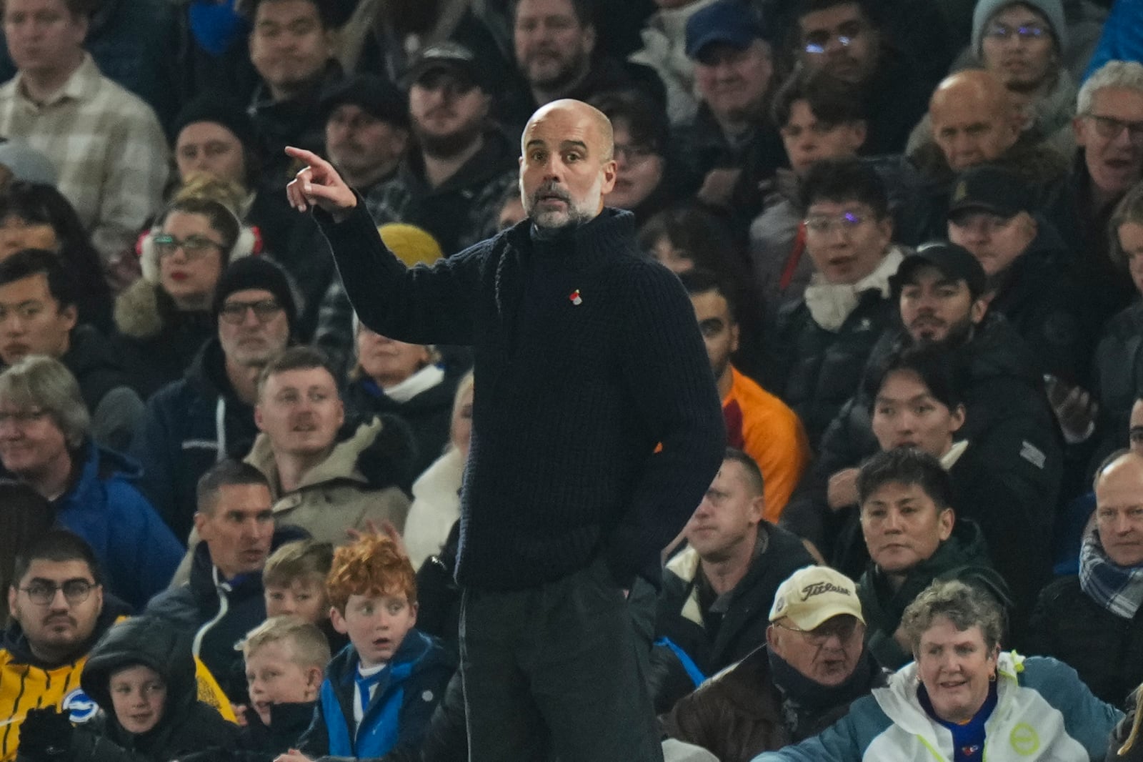 Manchester City's head coach Pep Guardiola reacts during the English Premier League soccer match between Brighton and Manchester City at Falmer Stadium in Brighton, England, Saturday, Nov. 9, 2024. (AP Photo/Alastair Grant)