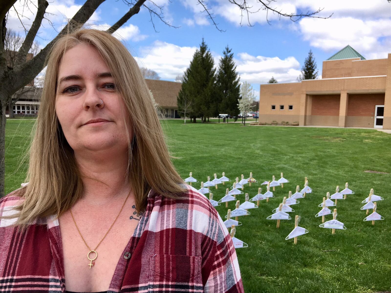 Miami University Hamilton student Amy Malott stands near the pro-choice display she and other members of the College Students for Reproductive Justice erected on campus. The original display was stolen earlier this week and that follows last week’s destruction of a student-created, pro-life exhibit. 