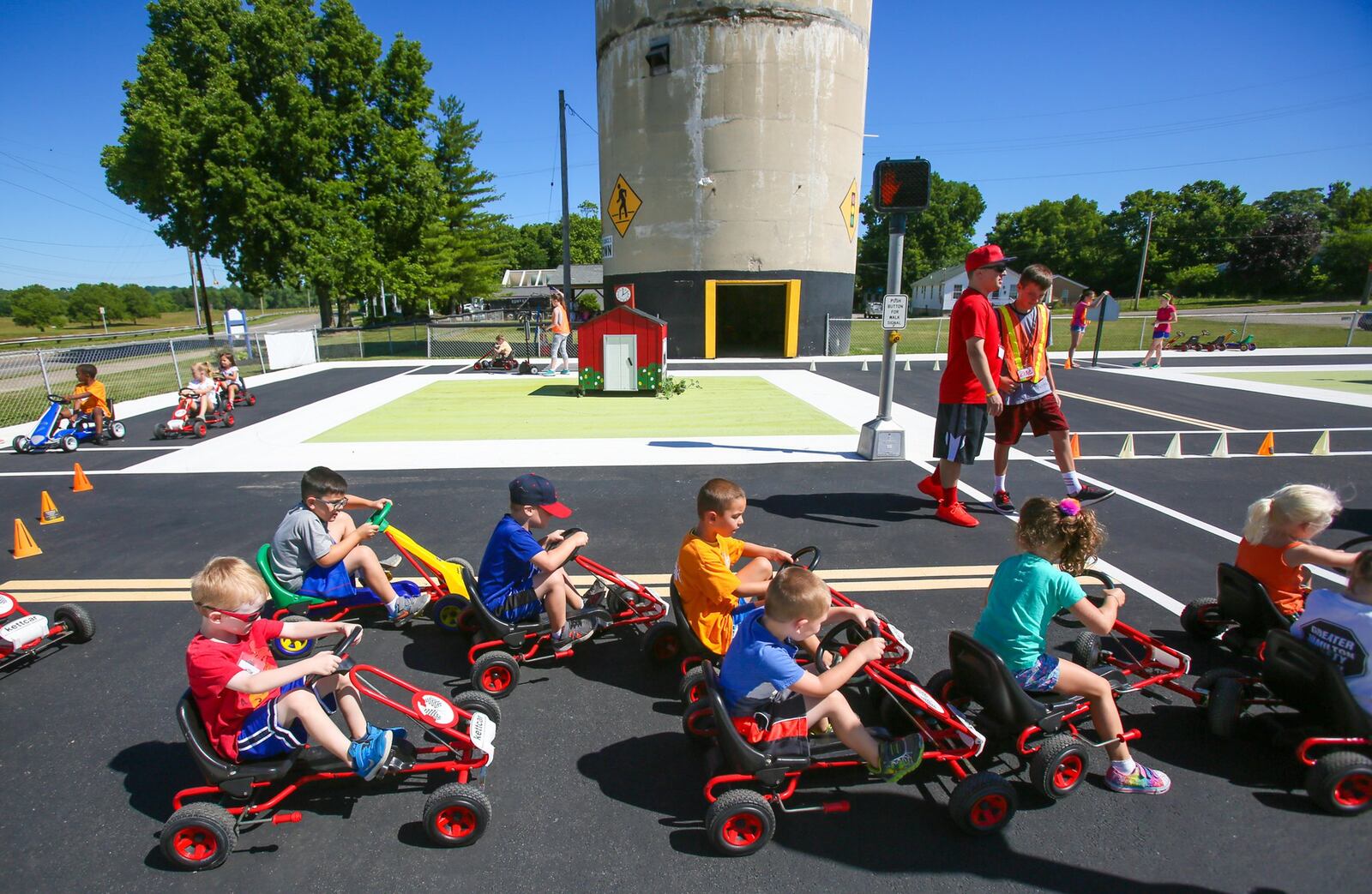 This photo is from 2017: Children learn about road rules during Safety Town this week at Officer Bob Gentry Park in Hamilton. GREG LYNCH / STAFF