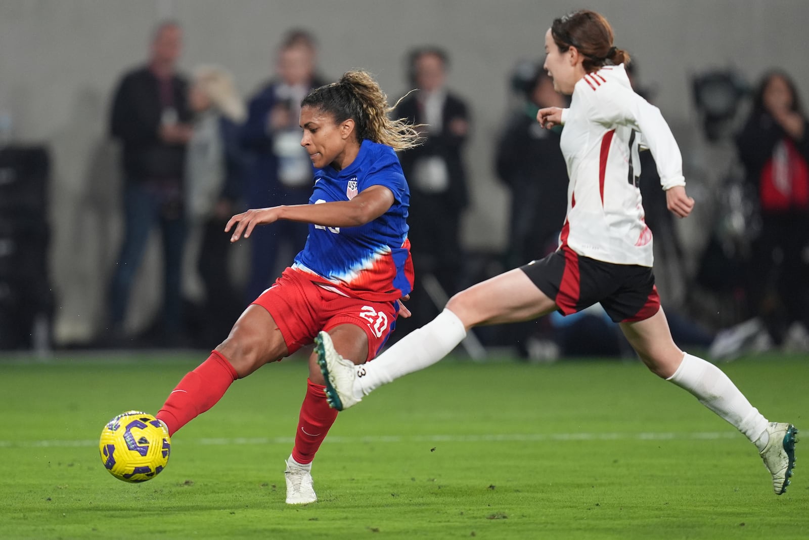 United States forward Catarina Macario, left, shoots and misses as Japan defender Hikaru Kitagawa defends during the first half of a SheBelieves Cup women's soccer tournament match Wednesday, Feb. 26, 2025, in San Diego. (AP Photo/Gregory Bull)