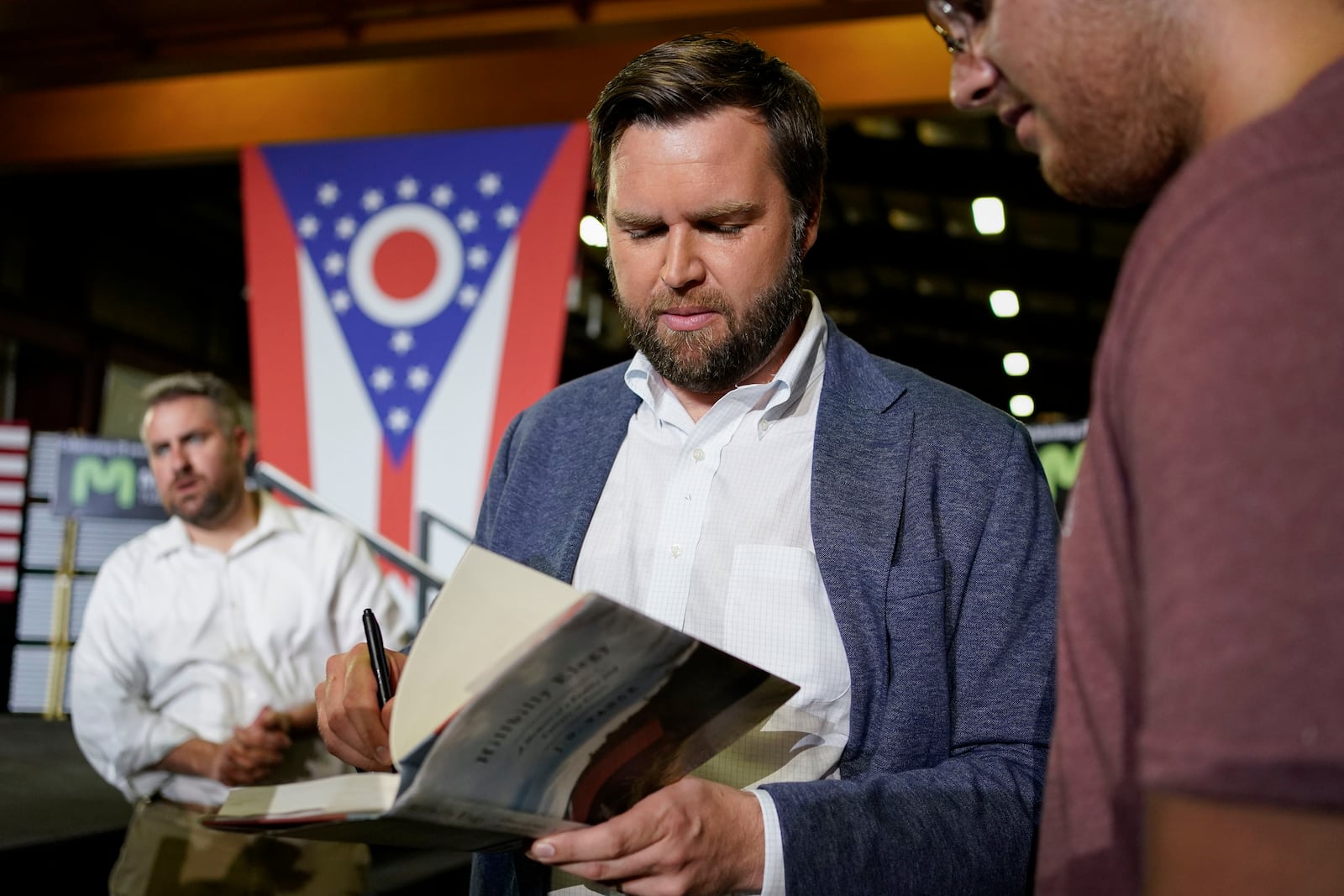 JD Vance, the venture capitalist and author of "Hillbilly Elegy", speaks with supporters following a rally Thursday, July 1, 2021, in Middletown, Ohio, where he announced he is joining the crowded Republican race for the Ohio U.S. Senate seat being left by Rob Portman. (AP Photo/Jeff Dean)