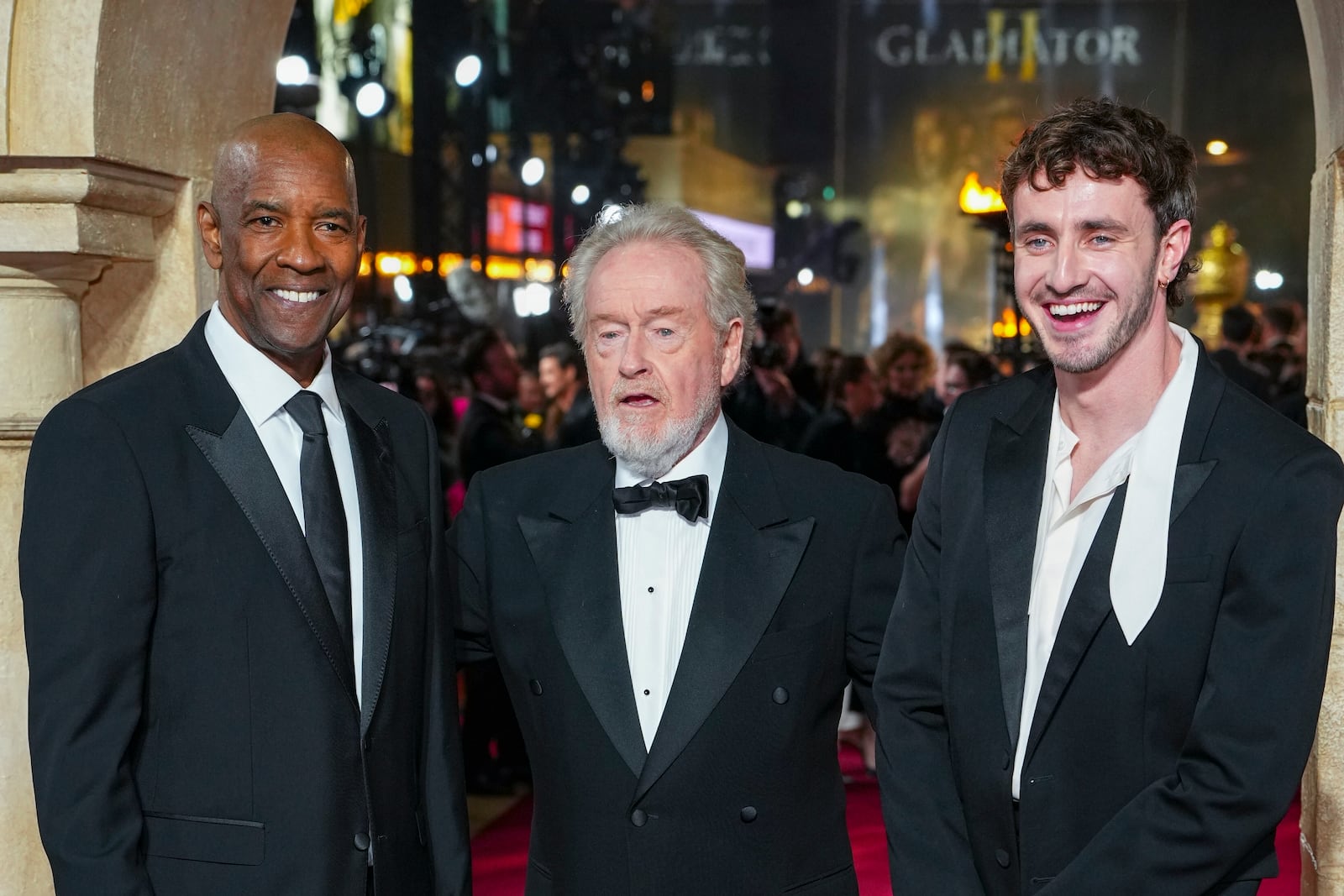 Denzel Washington, from left, director Ridley Scott, left, and Paul Mescal pose for photographers upon arrival at the premiere of the film 'Gladiator II' on Wednesday, Nov. 13, 2024, in London. (Photo by Scott A Garfitt/Invision/AP)