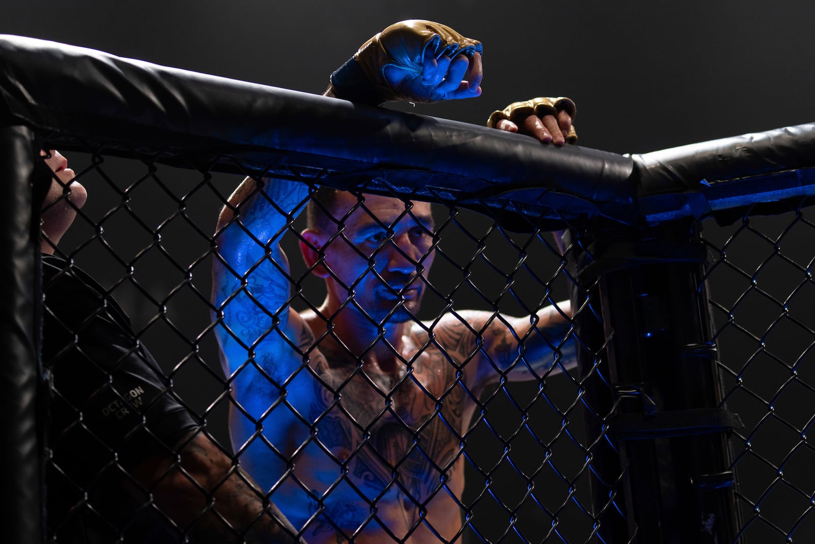 Challenger Max Holloway reacts after losing to champion Ilia Topuria in a mixed martial arts featherweight title bout at UFC Fight Night on Saturday, Oct. 26, 2024, in Abu Dhabi, United Arab Emirates. (AP Photo/Altaf Qadri)