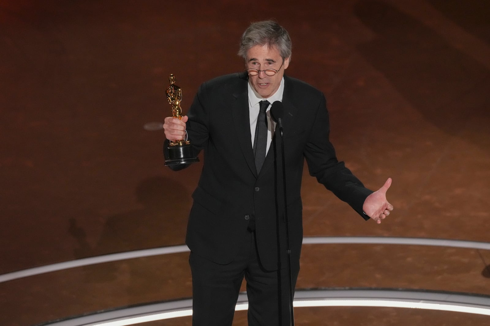 Walter Salles accepts the award for "I'm Still Here" from Brazil, for best international feature film during the Oscars on Sunday, March 2, 2025, at the Dolby Theatre in Los Angeles.(AP Photo/Chris Pizzello)