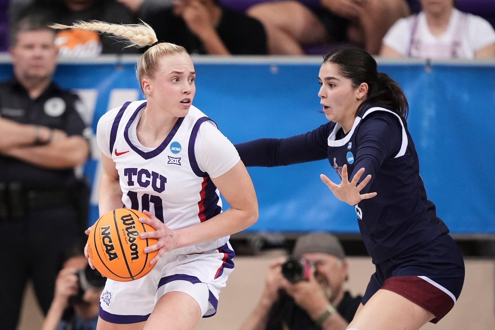 TCU guard Hailey Van Lith (10) works against Fairleigh Dickinson guard Abaigeal Babore, right, in the first half in the first round of the NCAA college basketball tournament in Fort Worth, Texas, Friday, March 21, 2025. (AP Photo/Tony Gutierrez)