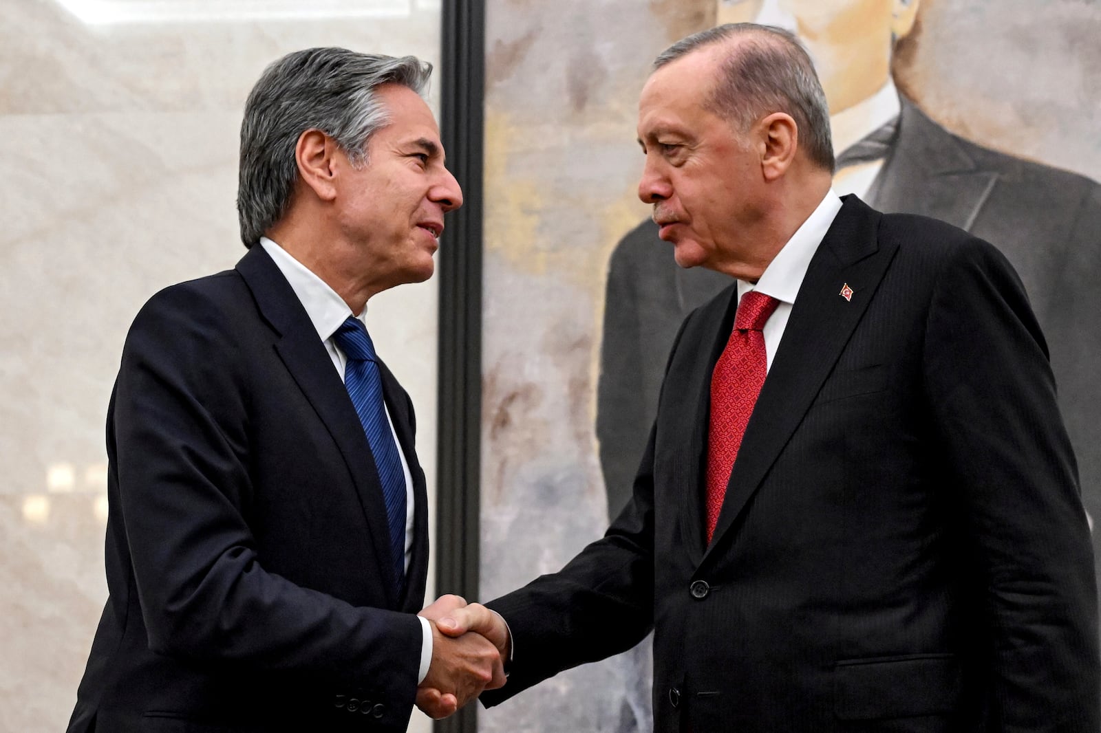 US Secretary of State Antony Blinken, left, shakes hands with Turkey's President Recep Tayyip Erodgan, during their meeting at Ankara Esenboga Airport on December 12, 2024. (Andrew Caballero Reynolds, Pool Photo via AP)