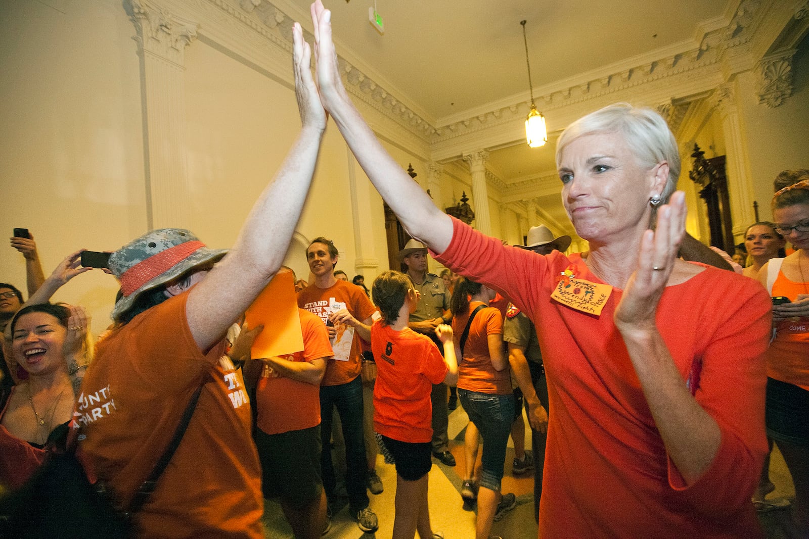 FILE - Cecile Richards, daughter of former Texas Gov. Ann Richards and President of Planned Parenthood Action Fund, greets abortion rights advocates as they leave the State Capitol rotunda in Austin, Texas, July 12, 2013. (AP Photo/Tamir Kalifa, File)