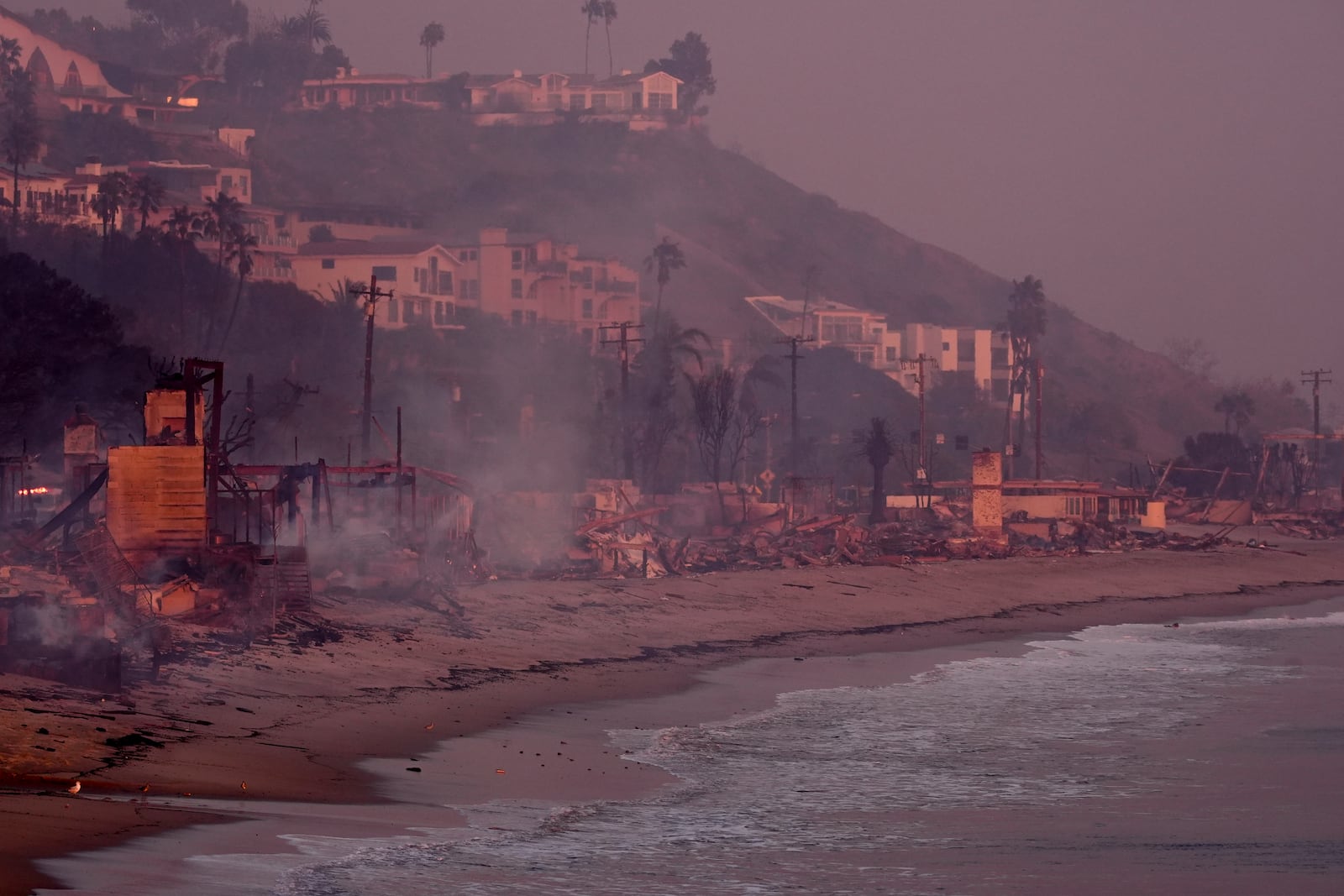 Beach front homes are destroyed by the Palisades Fire Wednesday, Jan. 8, 2025 in Malibu, Calif. (AP Photo/Mark J. Terrill)