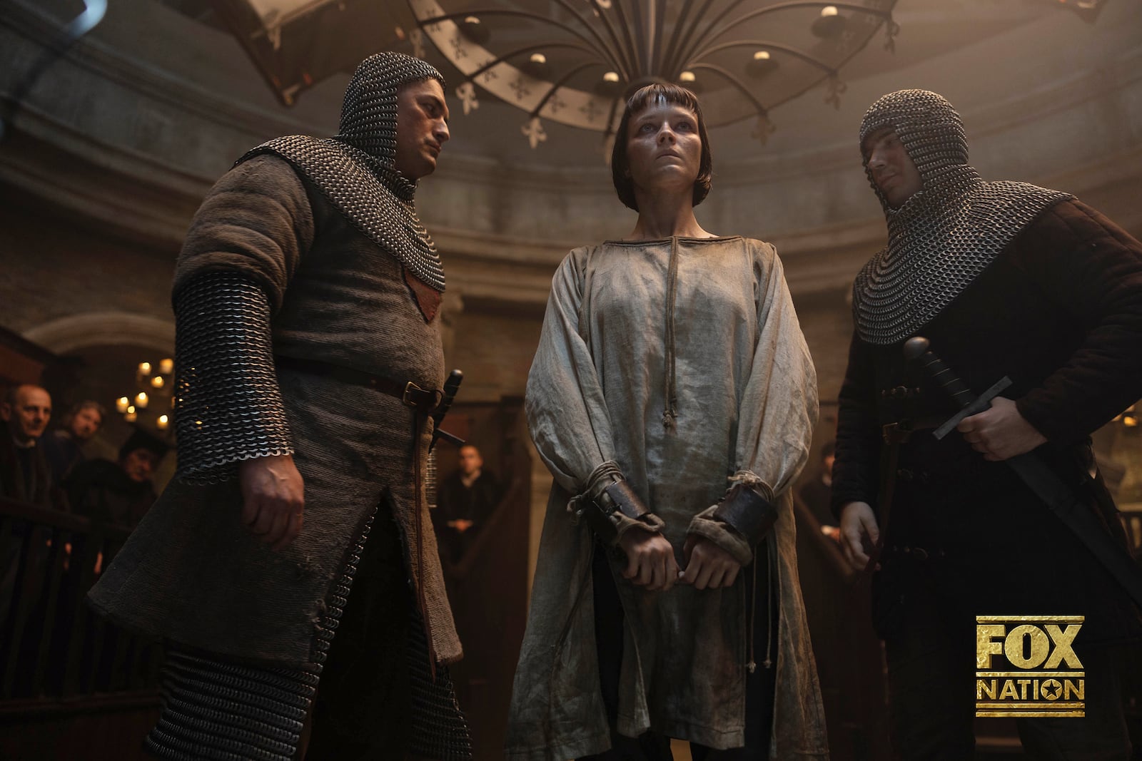 This image released by Fox Nation shows Liah O'Prey as Joan of Arc, center, in a scene from "Martin Scorsese Presents: The Saints," a new docudrama series by Martin Scorsese. (Slobodan Pikula/Fox Nation via AP)