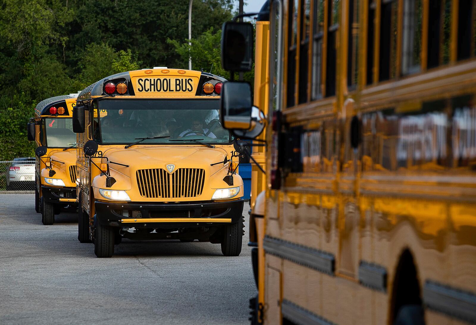 FILE - Jefferson County Public Schools buses make their way through the Detrick Bus Compound on the first day of school, Aug. 9, 2023, in Louisville, Ky. (Jeff Faughender/Courier Journal via AP, File)