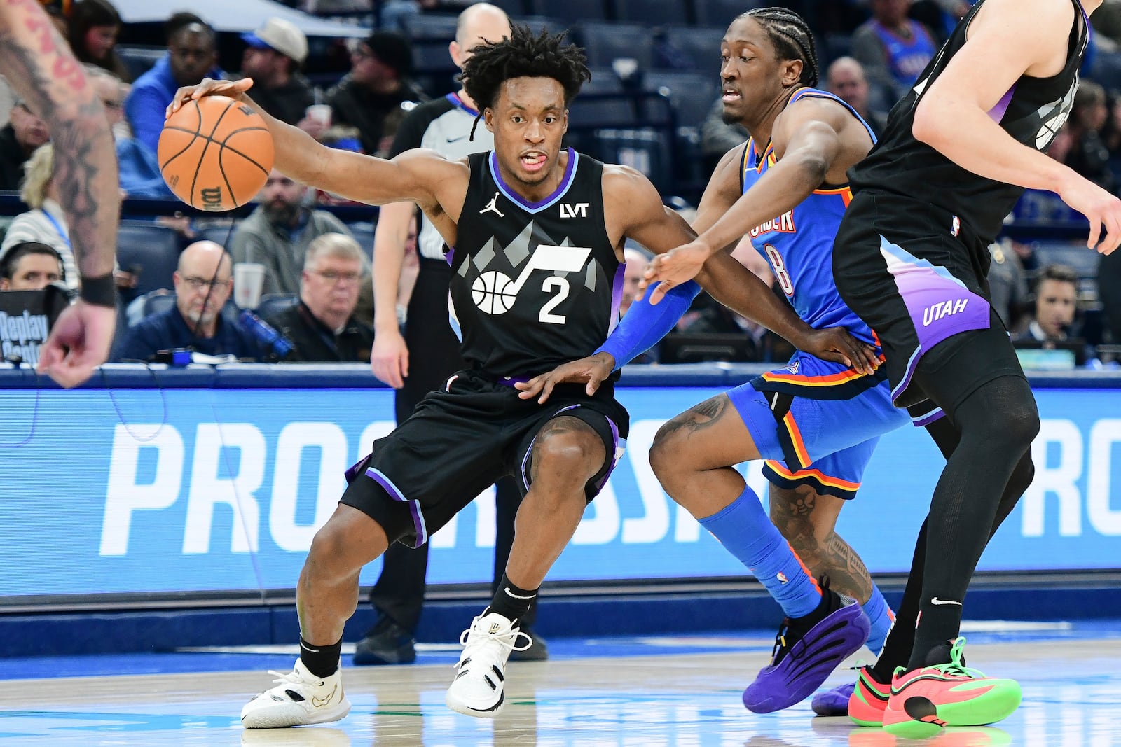 Utah Jazz guard Collin Sexton, left, drives past Oklahoma City Thunder forward Jalen Williams, right, during the second half of an NBA basketball game, Wednesday, Jan. 22, 2025, in Oklahoma City. (AP Photo/Kyle Phillips)