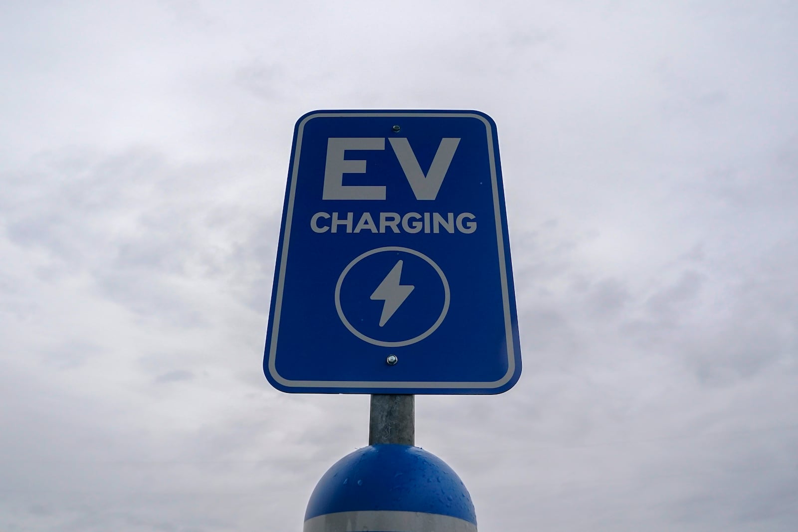 FILE - A sign is displayed at an electric vehicle charging station, March 8, 2024, in London, Ohio. (AP Photo/Joshua A. Bickel, File)