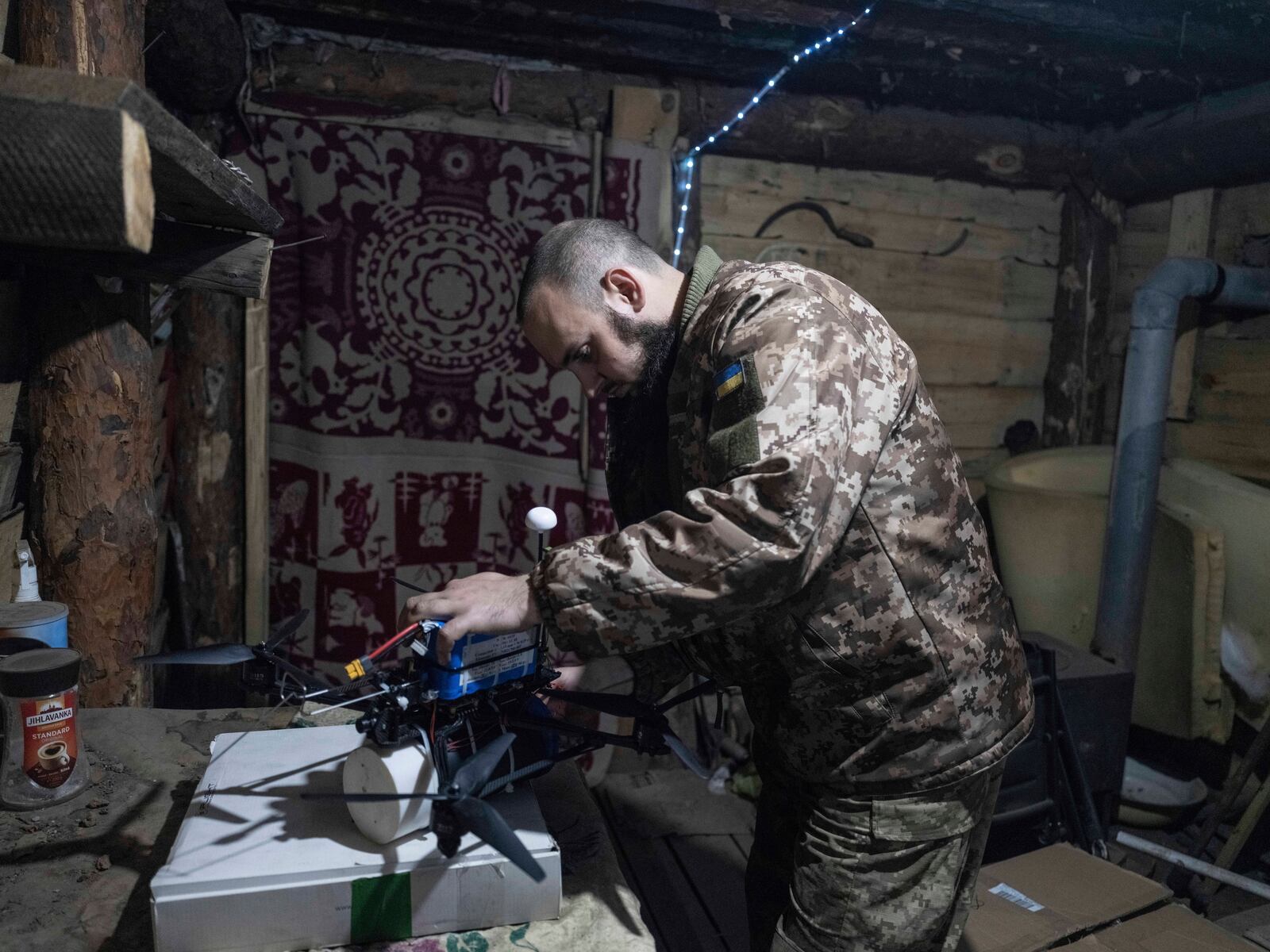 In this photo provided by Ukraine's 93rd Kholodnyi Yar Separate Mechanized Brigade press service, a soldier in a shelter gets ready to fire FPV drones towards Russian positions in a shelter in Kramatorsk direction, Donetsk region, Ukraine, Saturday, March 22, 2025. (Iryna Rybakova/Ukraine's 93rd Mechanized Brigade via AP)