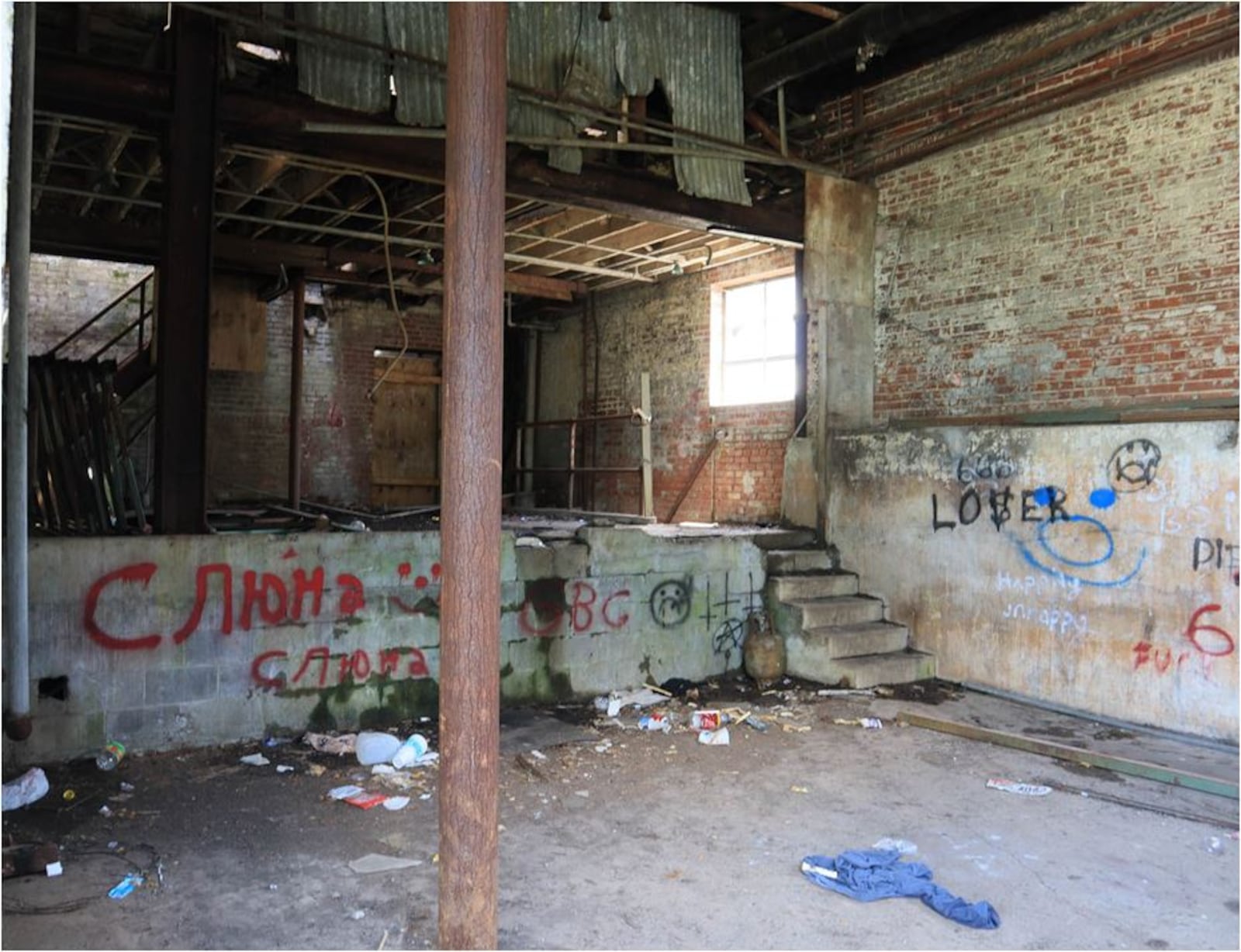 The former dairy building remains open to children and vandals. PROVIDED