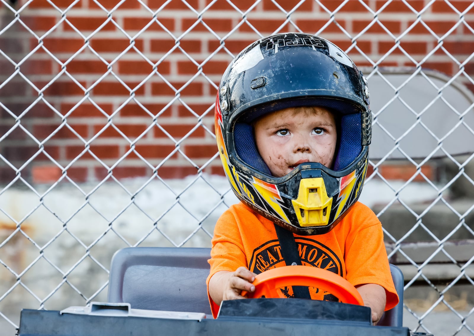 Brian Wallace, 2, gets ready for the kids' demolition derby at the Butler County Fair Friday, July 30, 2021, in Hamilton. NICK GRAHAM / STAFF