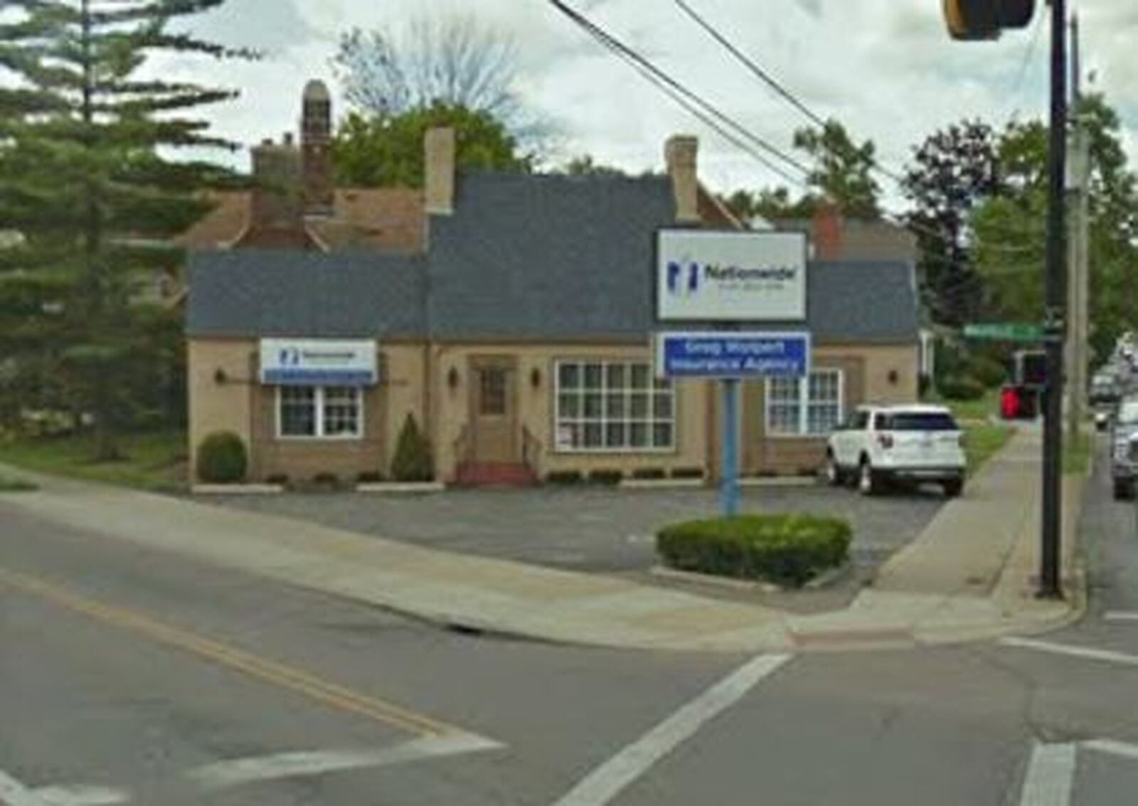 The former Wolpert insurance agency is among buildings that will be torn down to make way for soon-to-come improvements to the crossroads of Main Street with Eaton and Millville Avenues. MIKE RUTLEDGE/STAFF