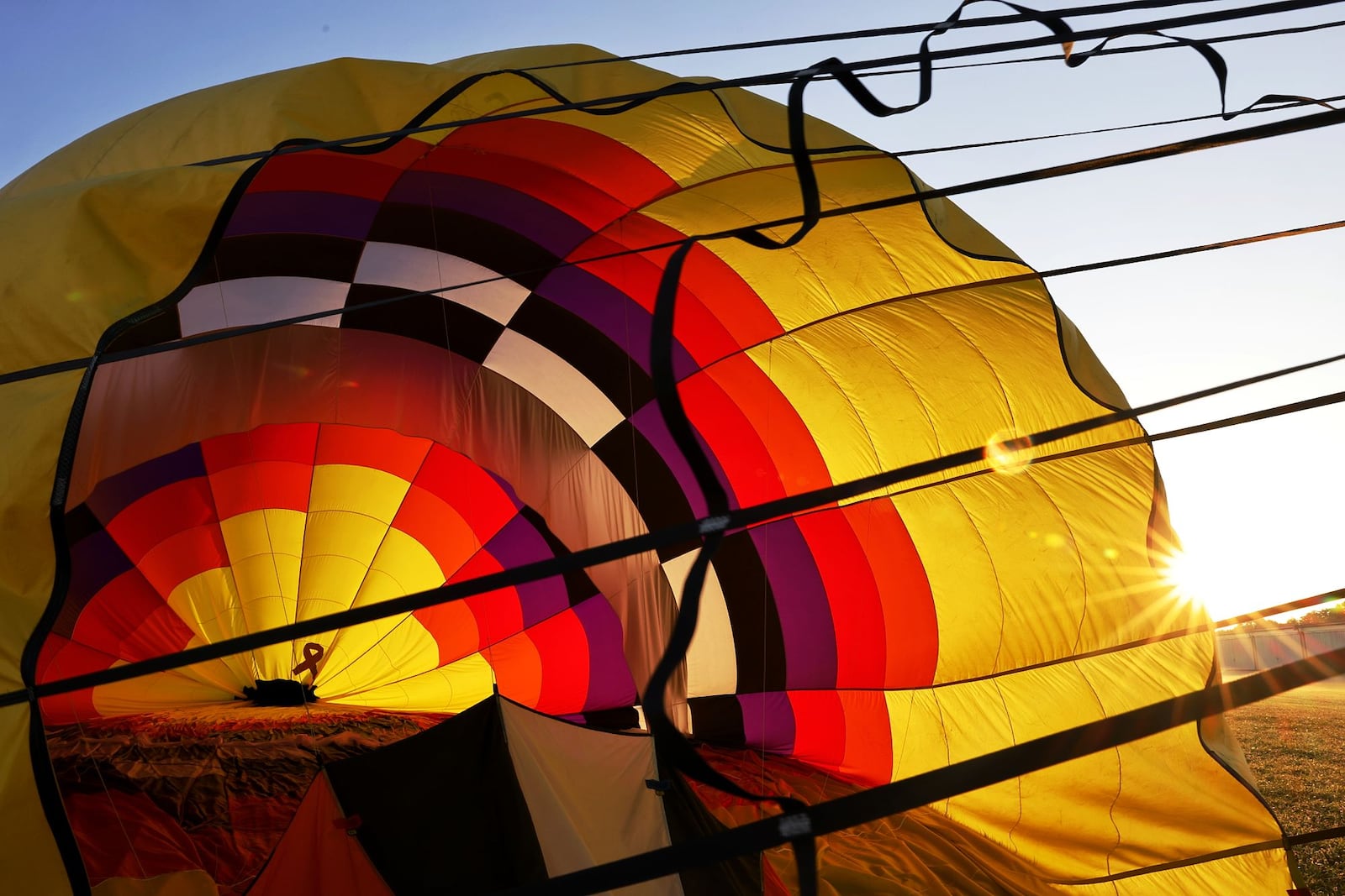 The Ohio Challenge hot air balloon festival is Friday and Saturday at Smith Park in Middletown. Crews deflate Sean Askren's DILLAGAF balloon at Middletown Regional Airport/Hook Field during a preview Thursday morning, July 14, 2022. NICK GRAHAM/STAFF