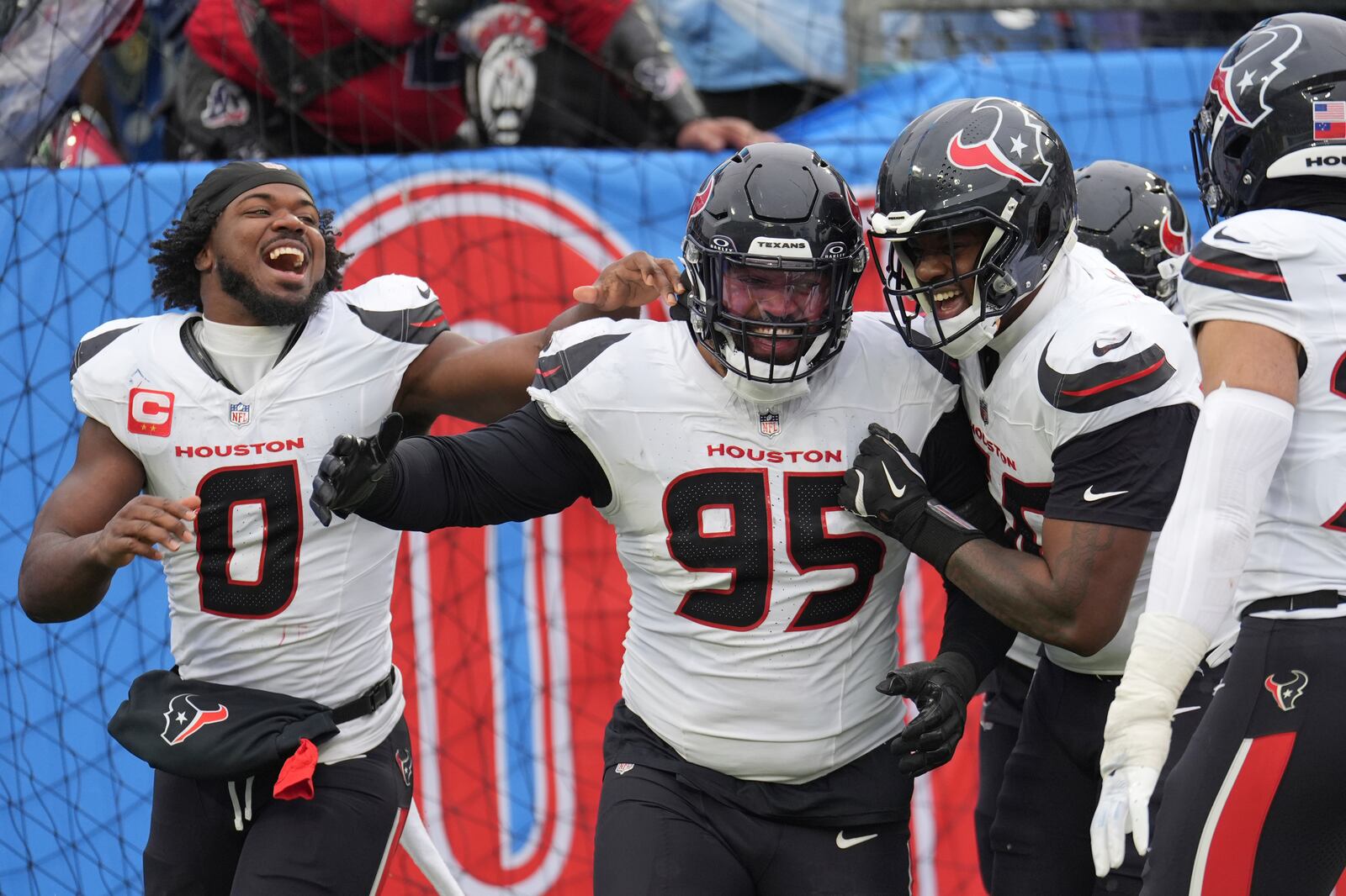 Houston Texans defensive end Derek Barnett (95) celebrates with teammates after returning a fumble for a touchdown against the Tennessee Titans during the second half of an NFL football game Sunday, Jan. 5, 2025, in Nashville, Tenn. (AP Photo/George Walker IV)