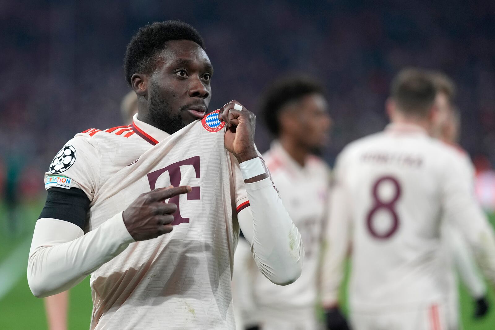 Bayern's Alphonso Davies celebrates after scoring his side's opening goal during the Champions League playoff second leg soccer match between FC Bayern Munich and Celtic Glasgow at the Allianz Arena in Munich, Germany, Tuesday, Feb. 18, 2025. (AP Photo/Matthias Schrader)