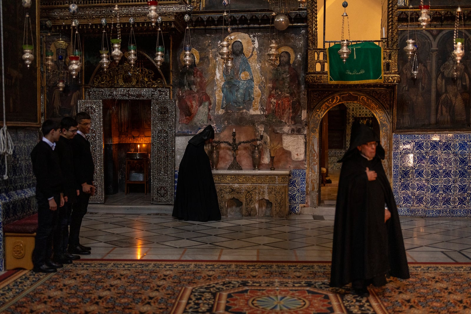 Armenian Christian clergy and young seminars attend the daily afternoon prayer service at the St. James Cathedral at the Armenian quarter in Jerusalem, Thursday, Nov. 21, 2024. (AP Photo/Francisco Seco)