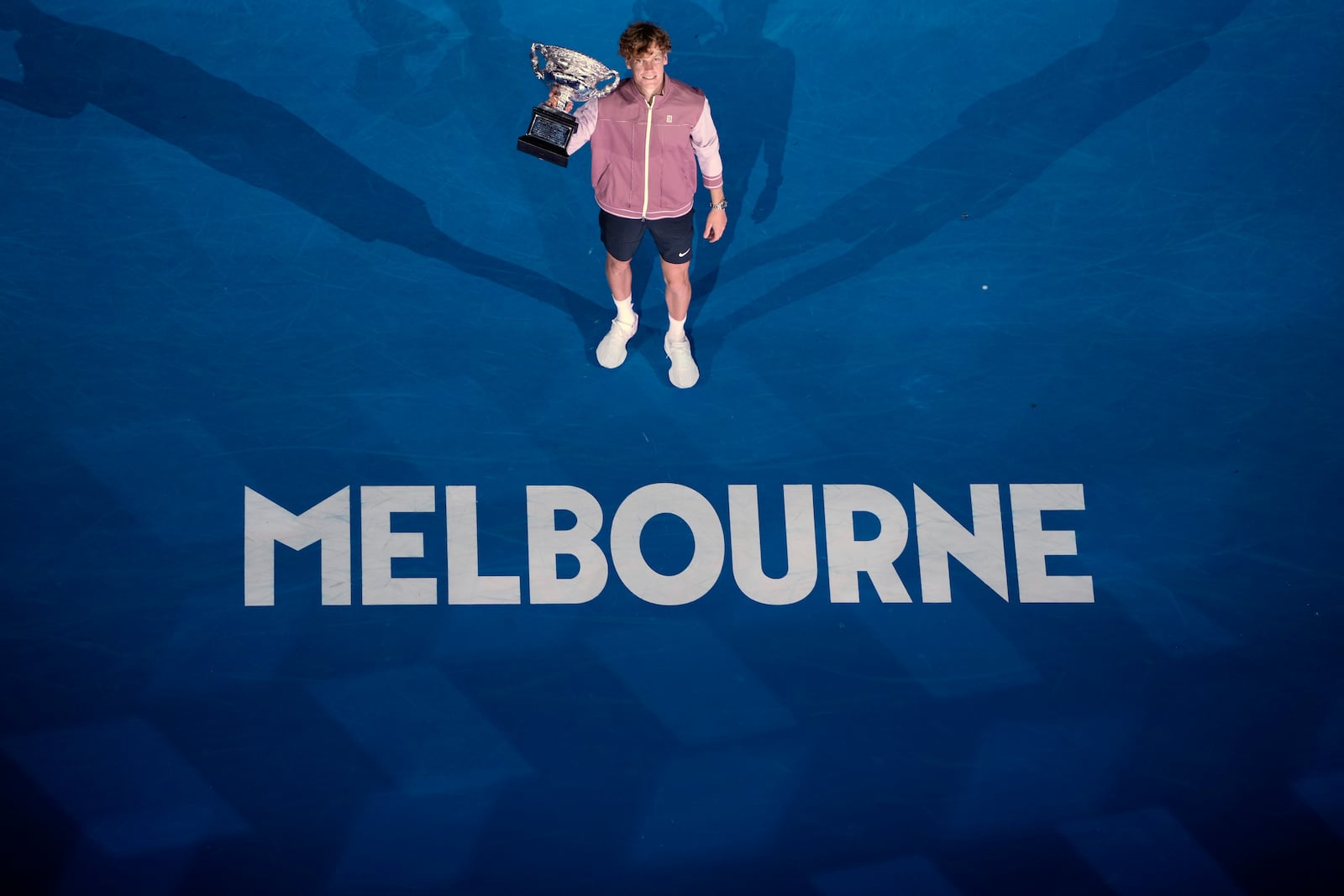 FILE - Jannik Sinner of Italy poses with the the Norman Brookes Challenge Cup after defeating Daniil Medvedev of Russia in the men's singles final at the Australian Open tennis championships at Melbourne Park, in Melbourne, Australia, Jan. 28, 2024. (AP Photo/Louise Delmotte, File)