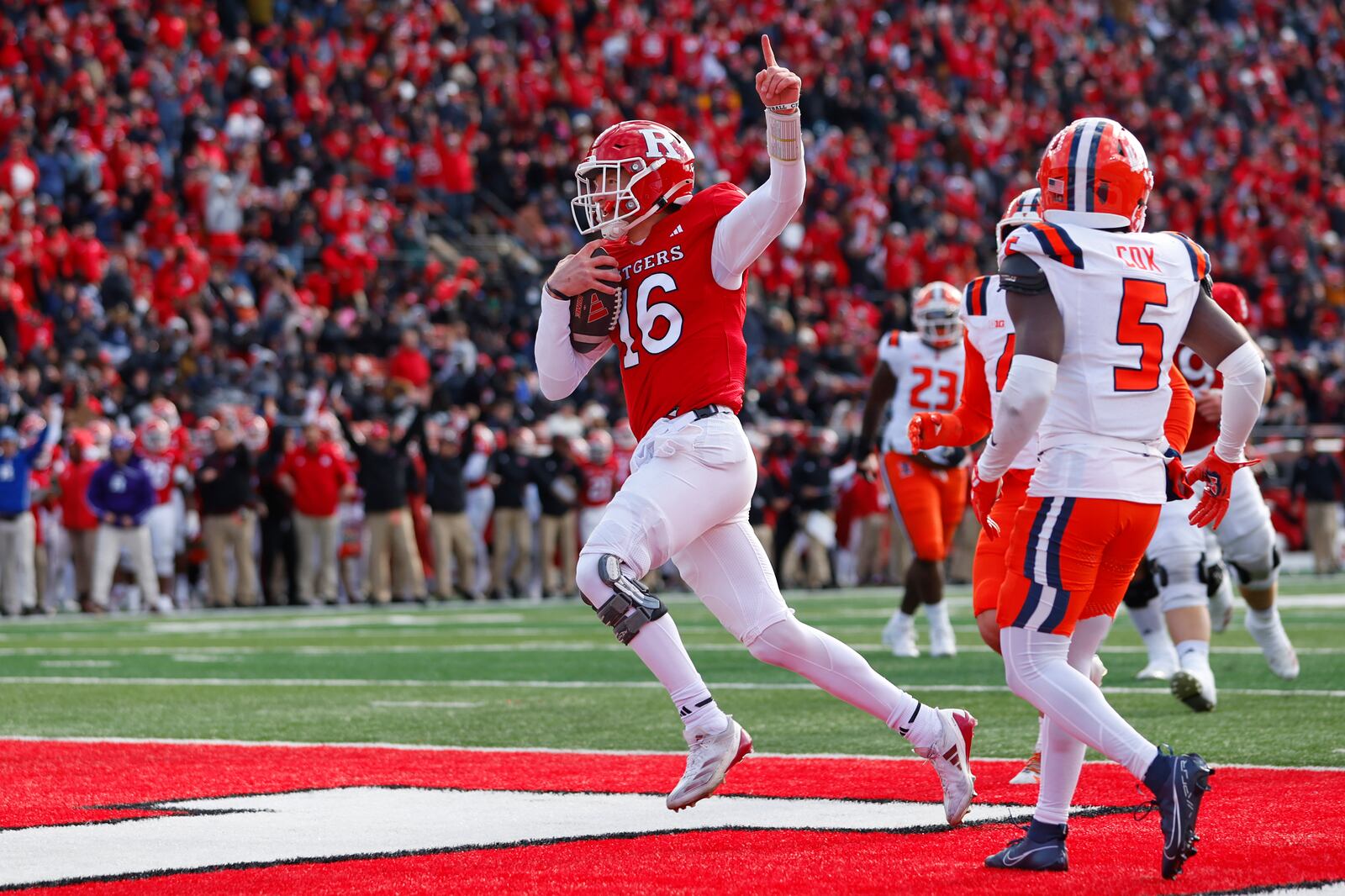 Rutgers quarterback Athan Kaliakmanis (16) gestures after running for a touchdown against the Illinois during the first half of an NCAA college football game Saturday, Nov. 23, 2024, in Piscataway, N.J. (AP Photo/Rich Schultz)