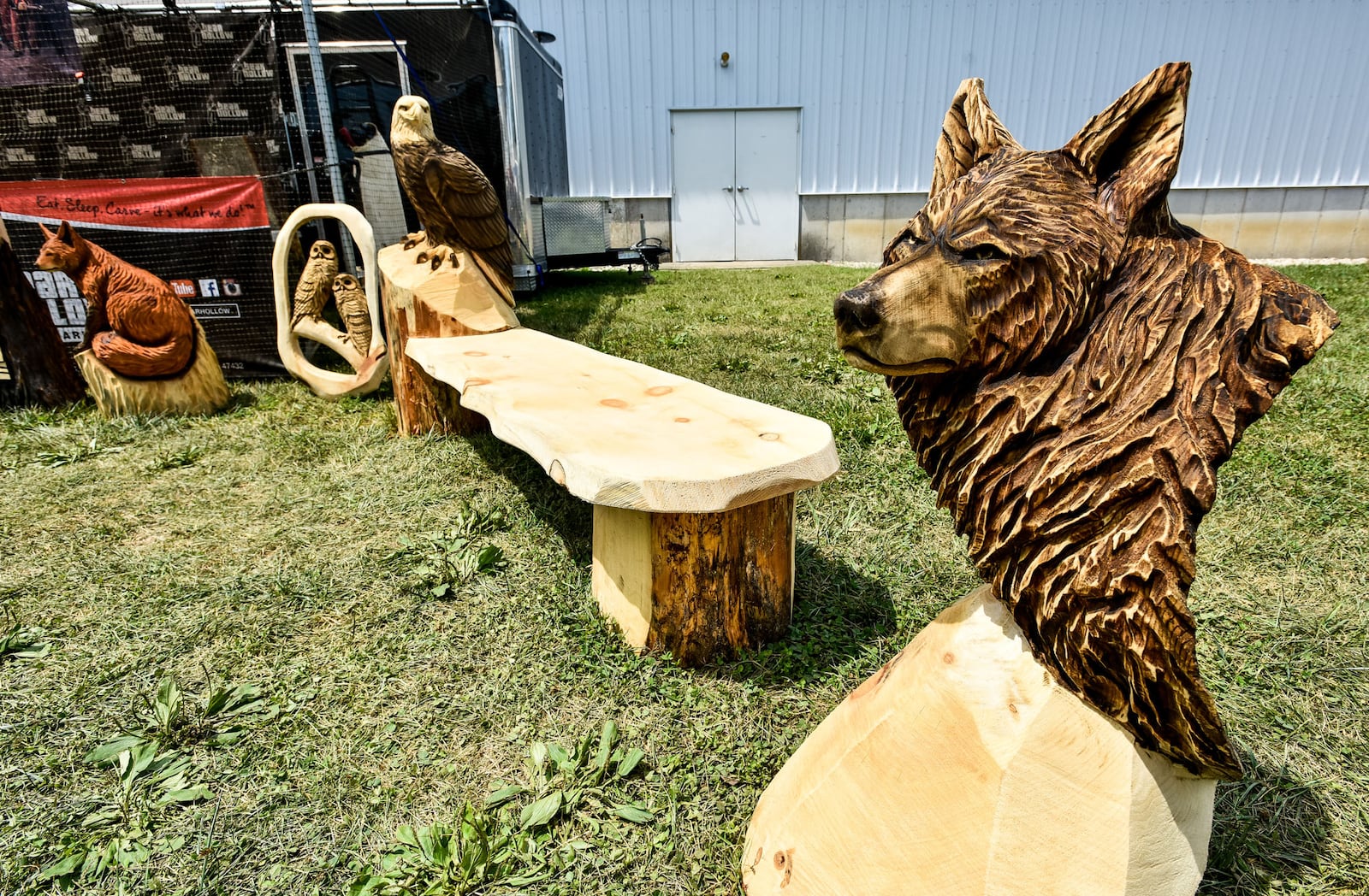 Chad Danczyk, from Wisconsin, a carver with Bear Hollow Wood Carvers, has some of his art on display during the Butler County Fair Thursday, July 26 at the Butler County Fairgrounds in Hamilton. Danczyk will carve sixteen pieces during the fair that are auctioned off before the Showman of Showmen Friday afternoon with proceeds going to the fair building fund. 