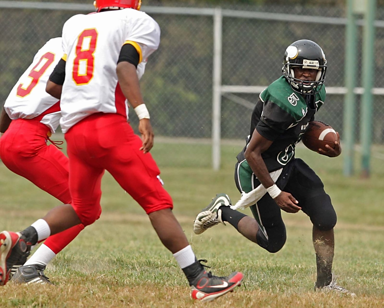 Josh Hampton (5) of New Miami carries the ball during a game against visiting North College Hill on Sept. 20, 2008. JOURNAL-NEWS FILE PHOTO