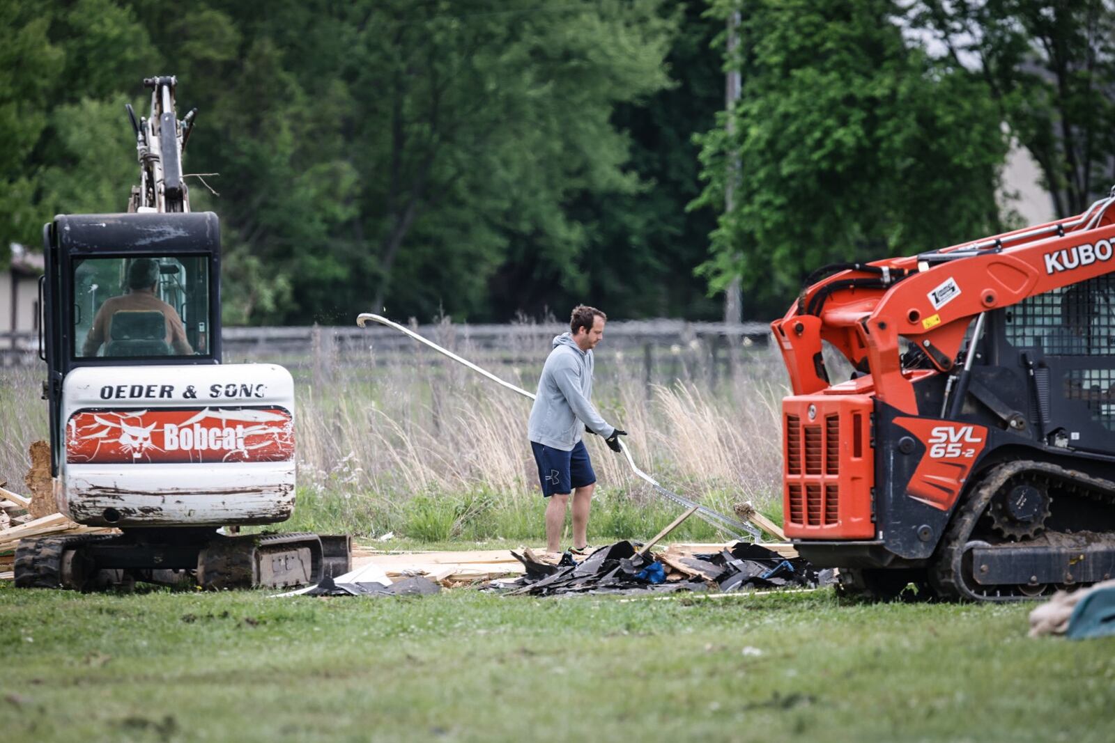 Cleanup crews remove debris from a Warren County property on Browning Drive that was damaged by one of five twisters that plowed through the county Tuesday night, May 7, 2024. JIM NOELKER/STAFF