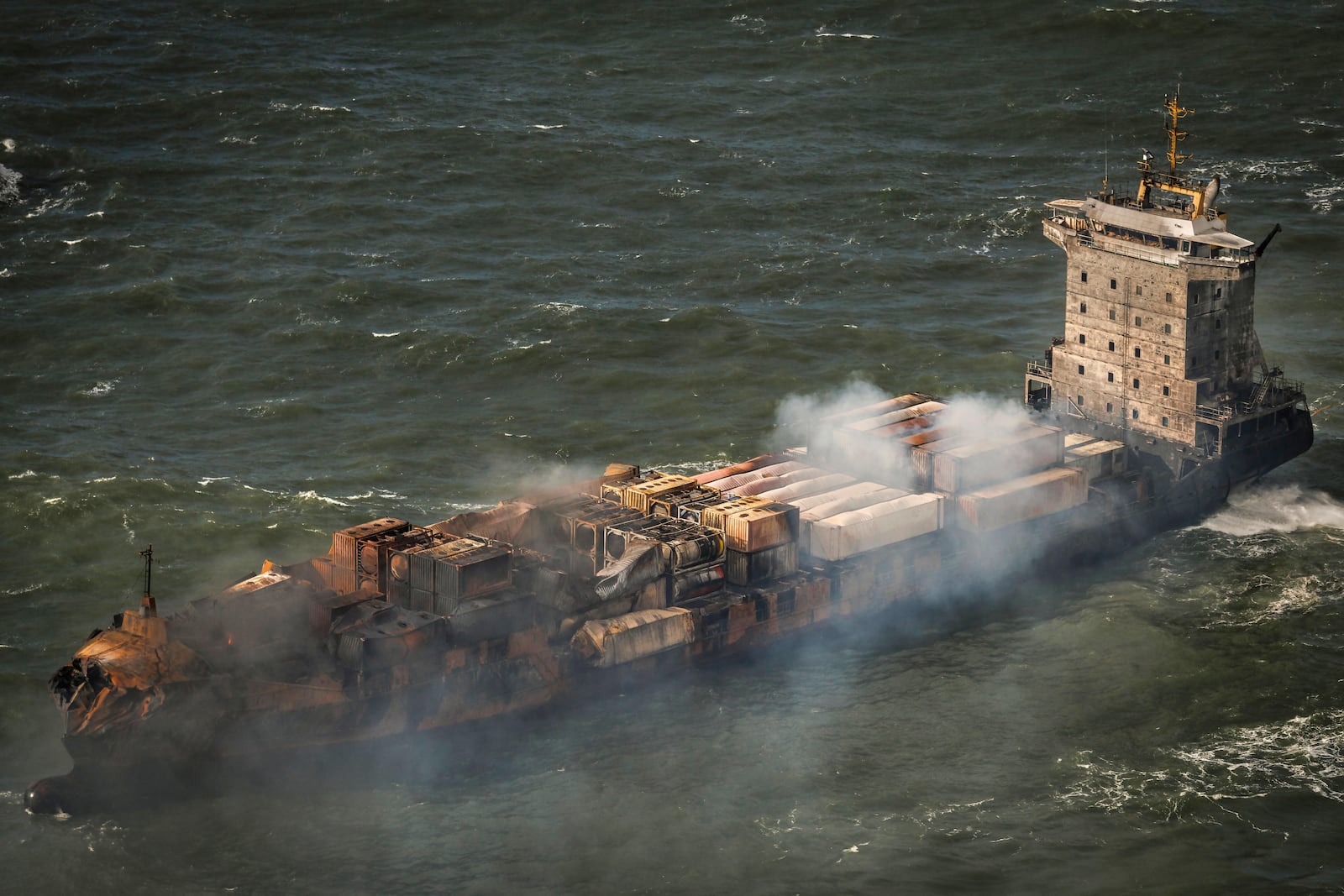 Smoke billows from the MV Solong cargo ship in the North Sea, off the Yorkshire coast, Tuesday, March 11, 2025, in England. (Dan Kitwood/Pool Photo via AP)