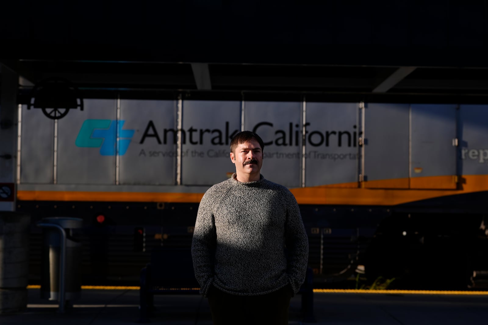 Jonah Paul, Digital Marketing Analyst at Employment Development Department, stands for photographs at the Jack London Square Amtrak Train station in Oakland, Calif., Friday, March 7, 2025. (AP Photo/Jeff Chiu)