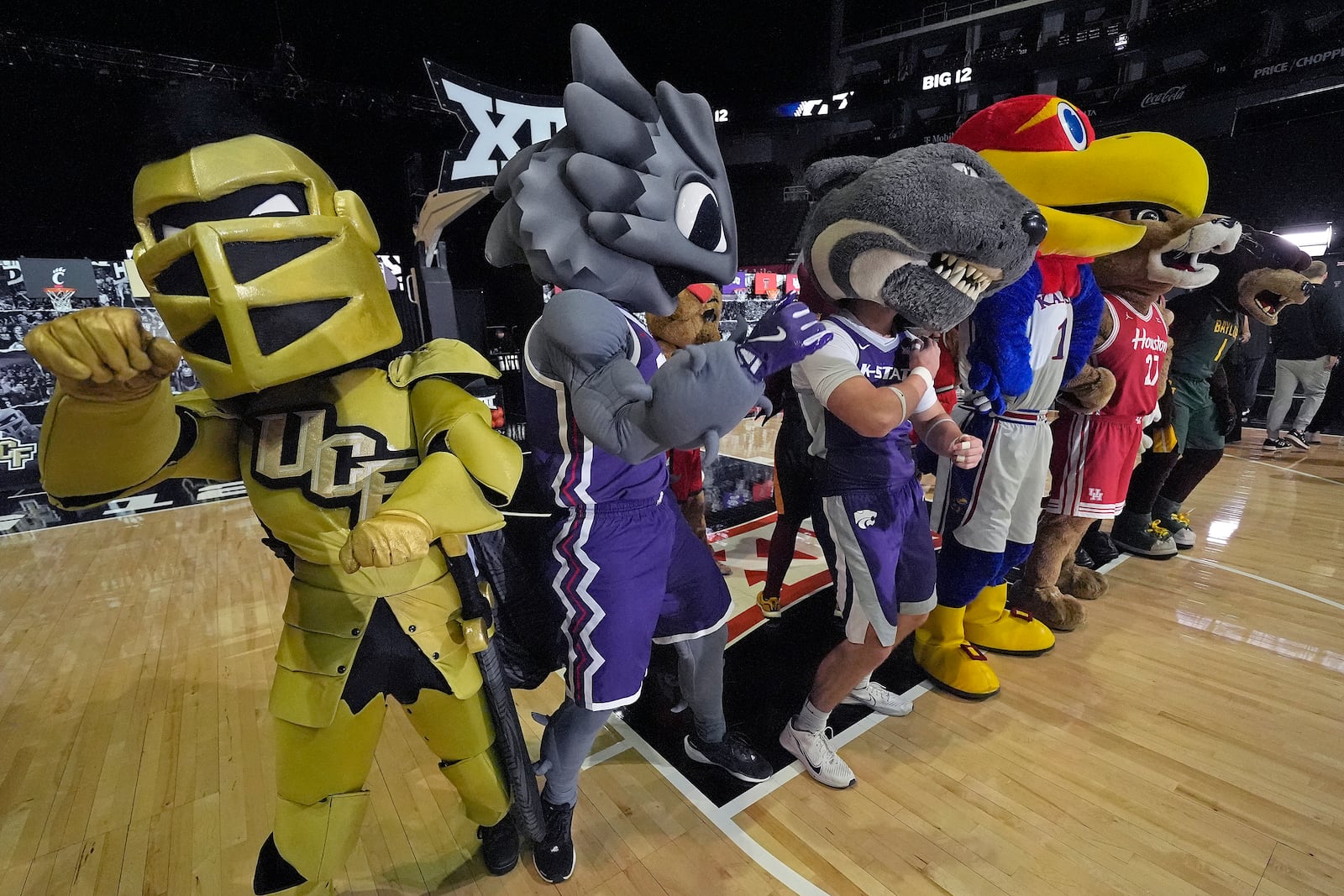 Big 12 mascots gather for a photo during the NCAA college Big 12 men's basketball media day, Wednesday, Oct. 23, 2024, in Kansas City, Mo. (AP Photo/Charlie Riedel)