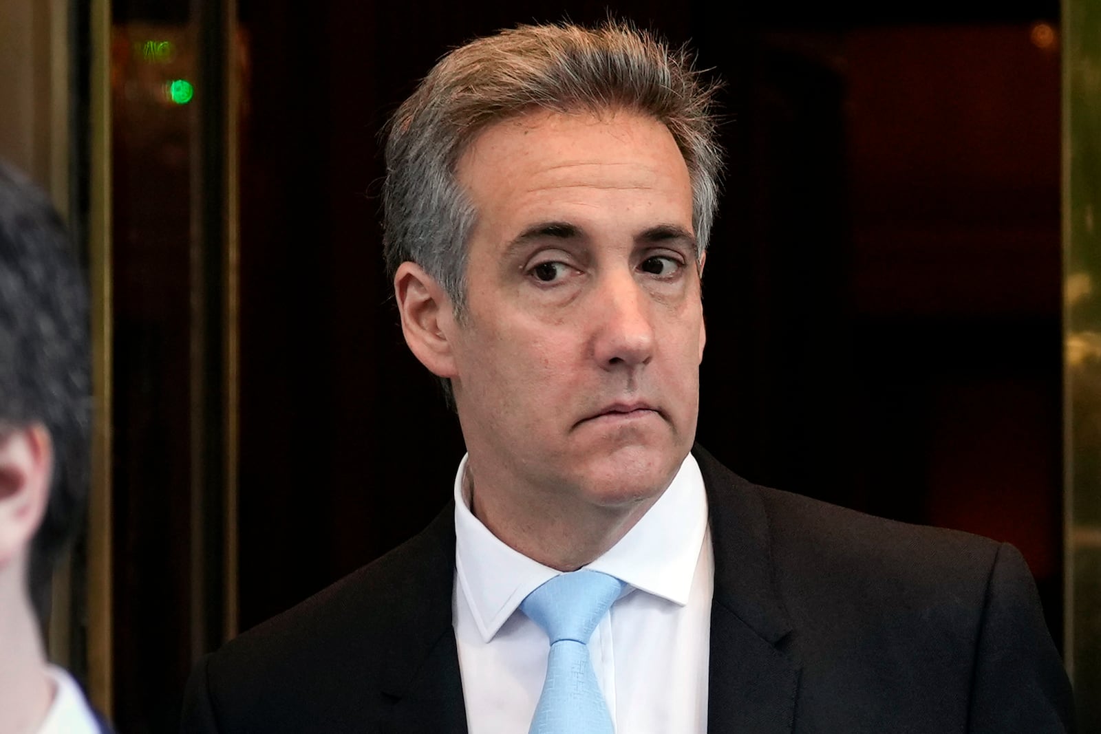 FILE — Michael Cohen leaves his apartment building in New York, May 14, 2024. (AP Photo/Seth Wenig, File)