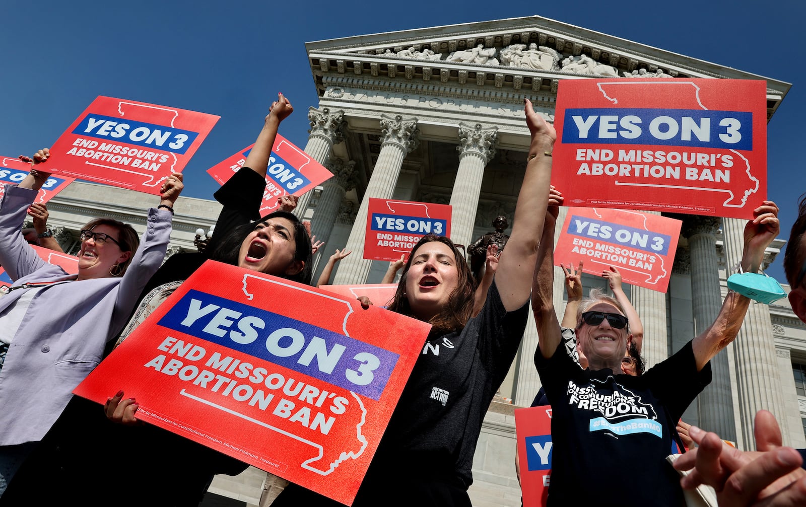 FILE - Amendment 3 supporters Luz Maria Henriquez, second from left, executive director of the ACLU Missouri, celebrates with Mallory Schwarz, center, of Abortion Action Missouri, after the Missouri Supreme Court in Jefferson City, Mo., ruled that the amendment to protect abortion rights would stay on the November ballot. Abortion-rights advocates will ask a judge Wednesday, Dec. 4, 2024 to overturn Missouri’s near-total ban on the procedure, less than a month after voters backed an abortion-rights constitutional amendment.(Robert Cohen/St. Louis Post-Dispatch via AP, File)