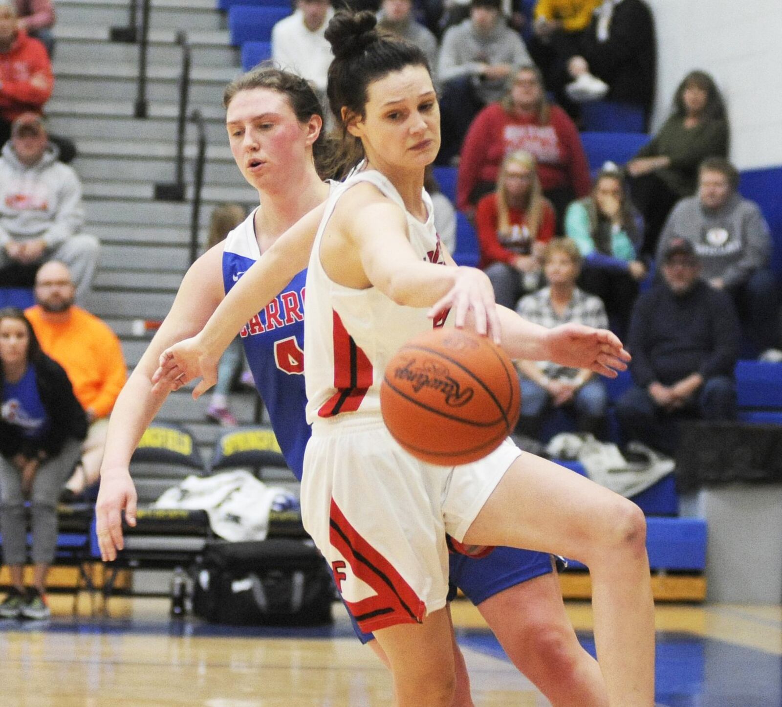 Franklin’s Layne Ferrell gets a rebound in front of Carroll’s Julia Keller during Friday night’s Division II regional basketball final at Springfield. Carroll won 57-43. MARC PENDLETON/STAFF