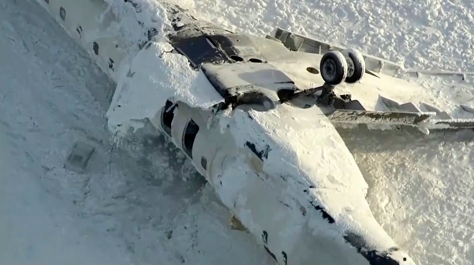 This image taken from video provided by CTV shows an aerial view of the overturned plane at Toronto Pearson Airport, Tuesday, Feb. 18, 2025. (CTV via AP)