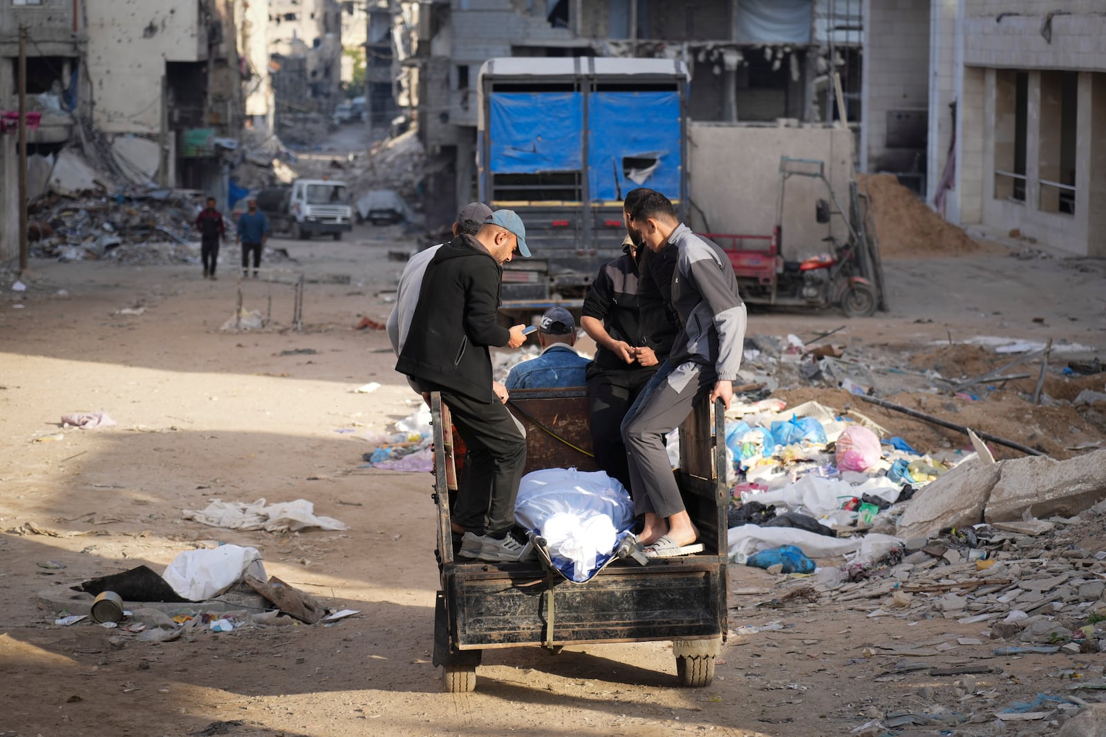 The body of a Palestinian killed in an Israeli army airstrikes is brought to Shifa Hospital in Gaza City, Tuesday, March 18, 2025. (AP Photo/Abdel Kareem Hana)