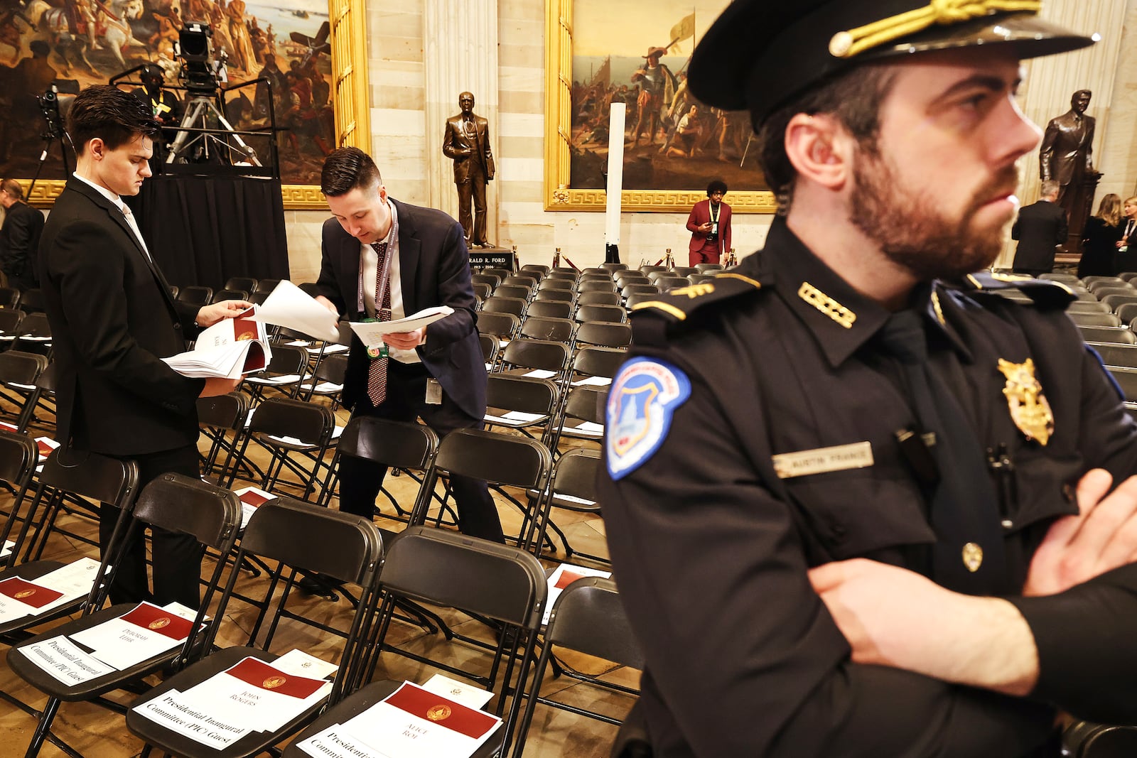 Staff prepare before the 60th Presidential Inauguration in the Rotunda of the U.S. Capitol in Washington, Monday, Jan. 20, 2025. (Chip Somodevilla/Pool Photo via AP)