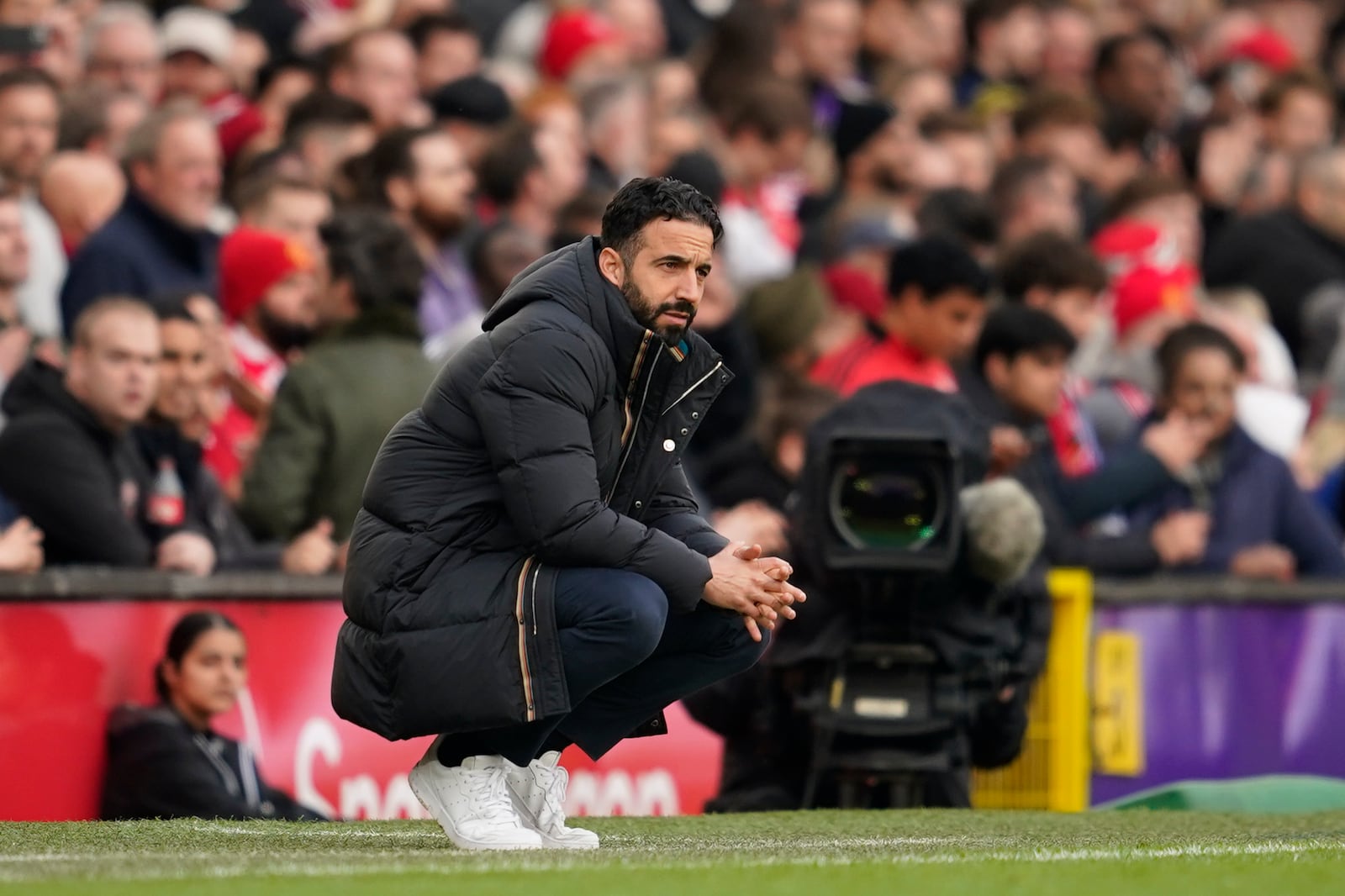 Manchester United's head coach Ruben Amorim follows the game of the English Premier League soccer match between Manchester United and Everton at the Old Trafford stadium in Manchester, England, Sunday, Dec. 1, 2024. (AP Photo/Dave Thompson)