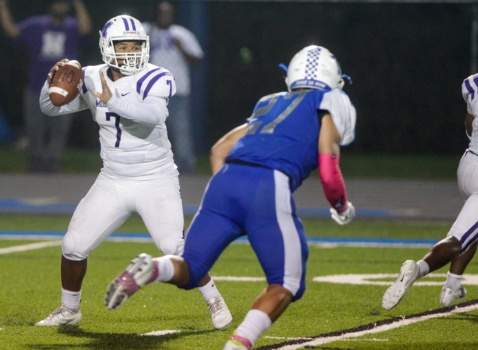 Hamilton’s Jordan Jones (27) comes after Middletown quarterback Kamari Fuller on Friday night at Virgil Schwarm Stadium in Hamilton. Big Blue got the home win 15-14. NICK GRAHAM/STAFF