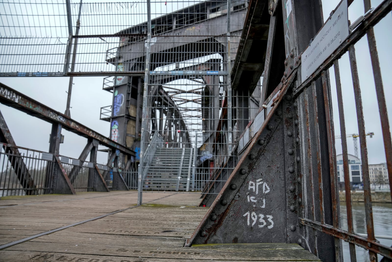 An anti AFD slogan is seen written on a bridge in the city of Magdeburg, Germany, Thursday, Feb. 6, 2025. (AP Photo/Ebrahim Noroozi)