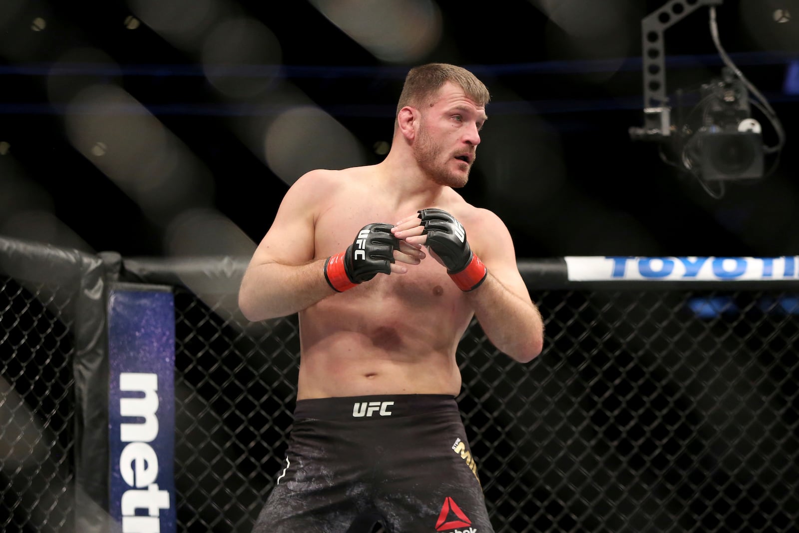 FILE - Stipe Miocic in action against Francis Ngannou during a heavyweight championship mixed martial arts bout at UFC 220, Sunday, Jan. 21, 2018, in Boston. (AP Photo/Gregory Payan, File)