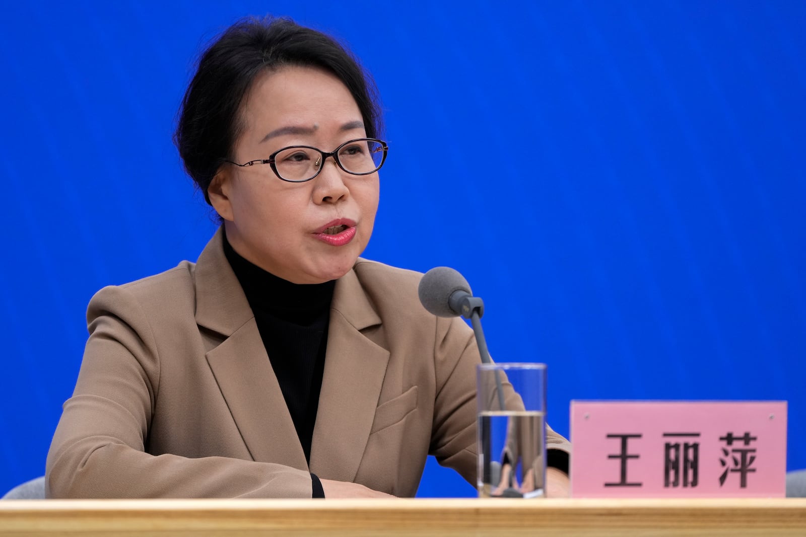 Wang Liping, a researcher for the Chinese Center for Disease Control and Prevention speaks during a press briefing by the National Health Commission as concerns surfaced in recent days over a surge in HMPV infections in northern China after images circulated online of hospitals overrun with masked patients, in Beijing, Sunday, Jan. 12, 2025. (AP Photo/Andy Wong)